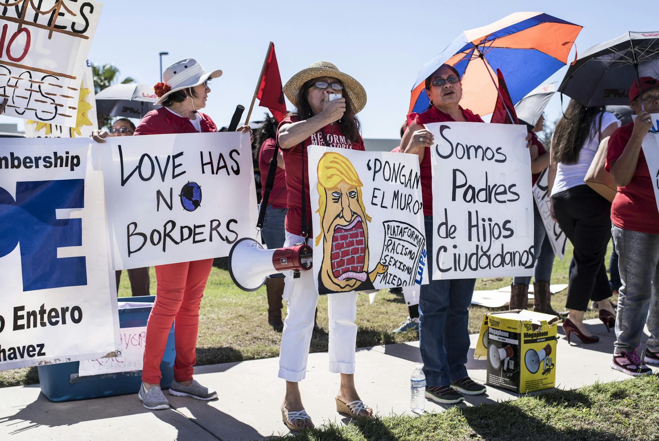 Martha Sanchez, center, uses a megaphone during a protest across the street from a Department of Homeland Security processing station in McAllen, Texas, Feb. 22, 2017. House Speaker Paul Ryan (R-Wis.) toured McAllen and the surrounding Rio Grande River Valley with Border officials on Wednesday, a visit that came as the Trump administration set off recently to reshape the nation’s immigration laws. (Matthew Busch/The New York Times)