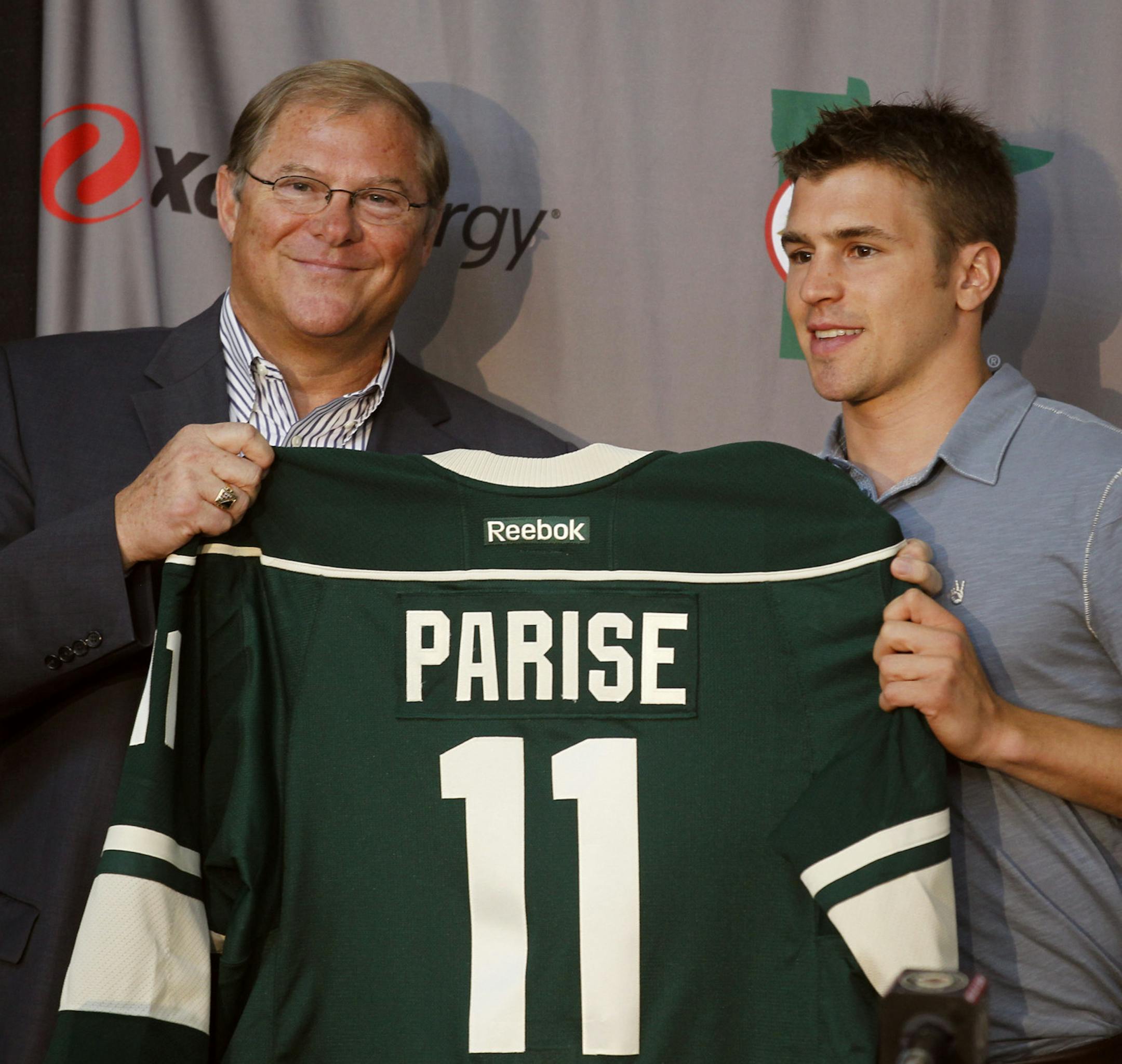 Wild owner Craig Leipold gave Zack Parise his new Wild Jersey at a news conference on July 9, 2012.