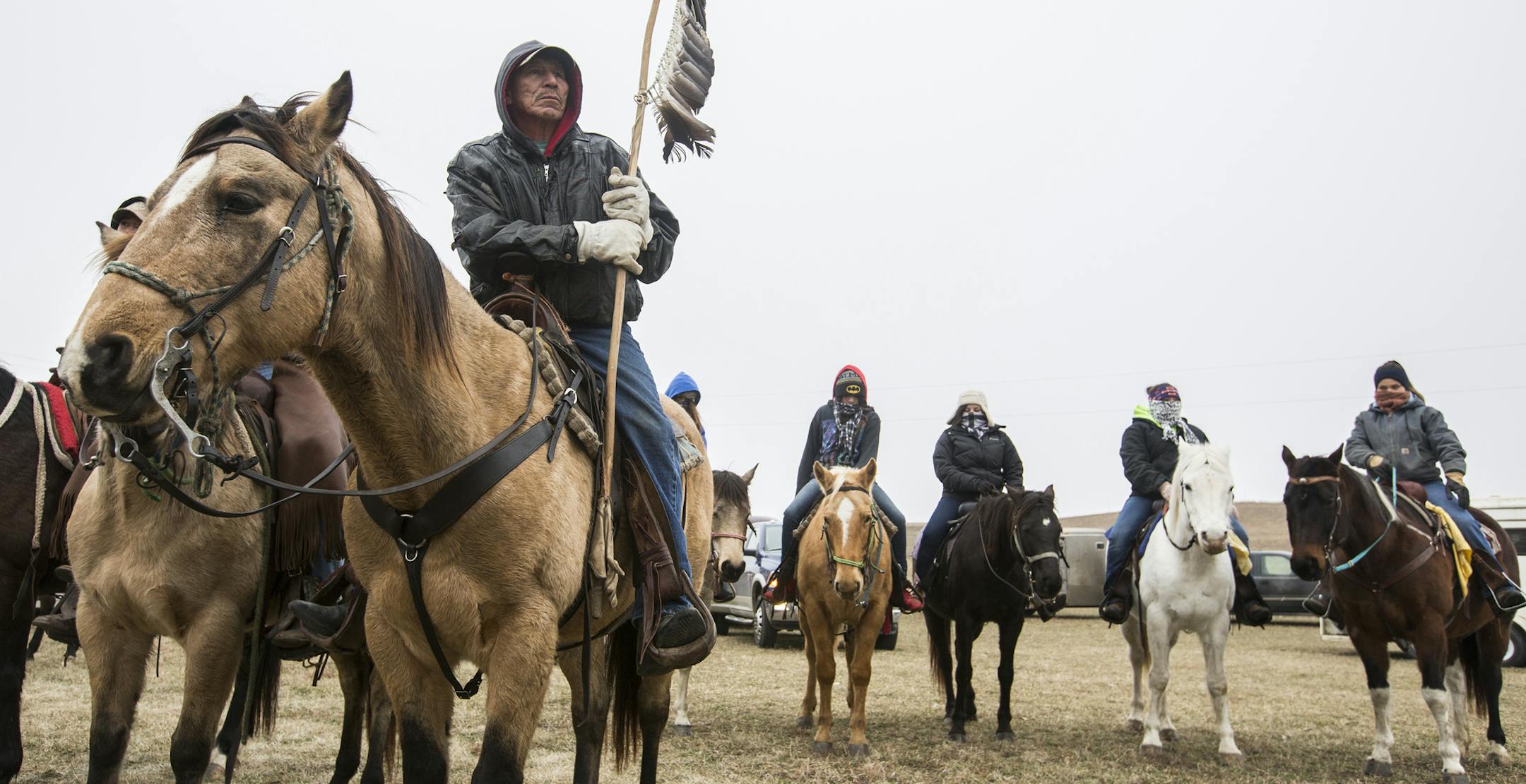 Wilfred Keeble of Crow Creek, S.D. is the staff bearer during the last leg of the Dakota Wokiksuye memorial ride from Courtland to Mankato on December 25, 2015. ] (Leila Navidi/Star Tribune) leila.navidi@startribune.com BACKGROUND INFORMATION: On December 26, 1862, on orders signed by President Lincoln, 38 Dakota fighters were hanged in Mankato following the bloody, six-week U.S.-Dakota War. Members of the Dakota tribe, joined by members of other tribal nations, have rode by horseback 330 miles