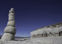 Visitors have stacked volcanic 'discs' near the mysterious volcanic columns on the eastern shore of Crowley Lake on Nov. 1, 2015 in Mono County, Calif