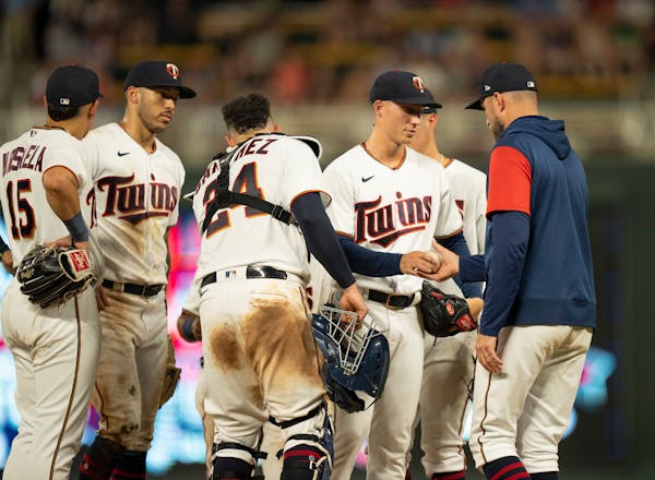 Twins manager Rocco Baldelli, right, pulled reliever Griffin Jax after he gave up the lead by allowing two runs in the seventh inning.