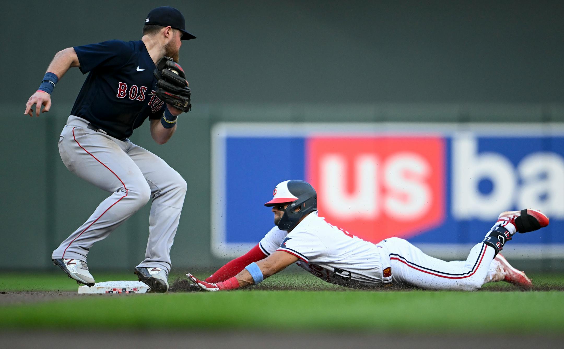 Boston Red Sox second baseman Christian Arroyo (39) is unable to get the tag as Minnesota Twins third baseman Royce Lewis (23) slides safely to second base after hitting a double in the bottom of the fourth inning Wednesday, June 21, 2023, at Target Field in Minneapolis, Minn.