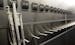A nearly empty hockey stick rack in the Buffalo Sabres locker room.