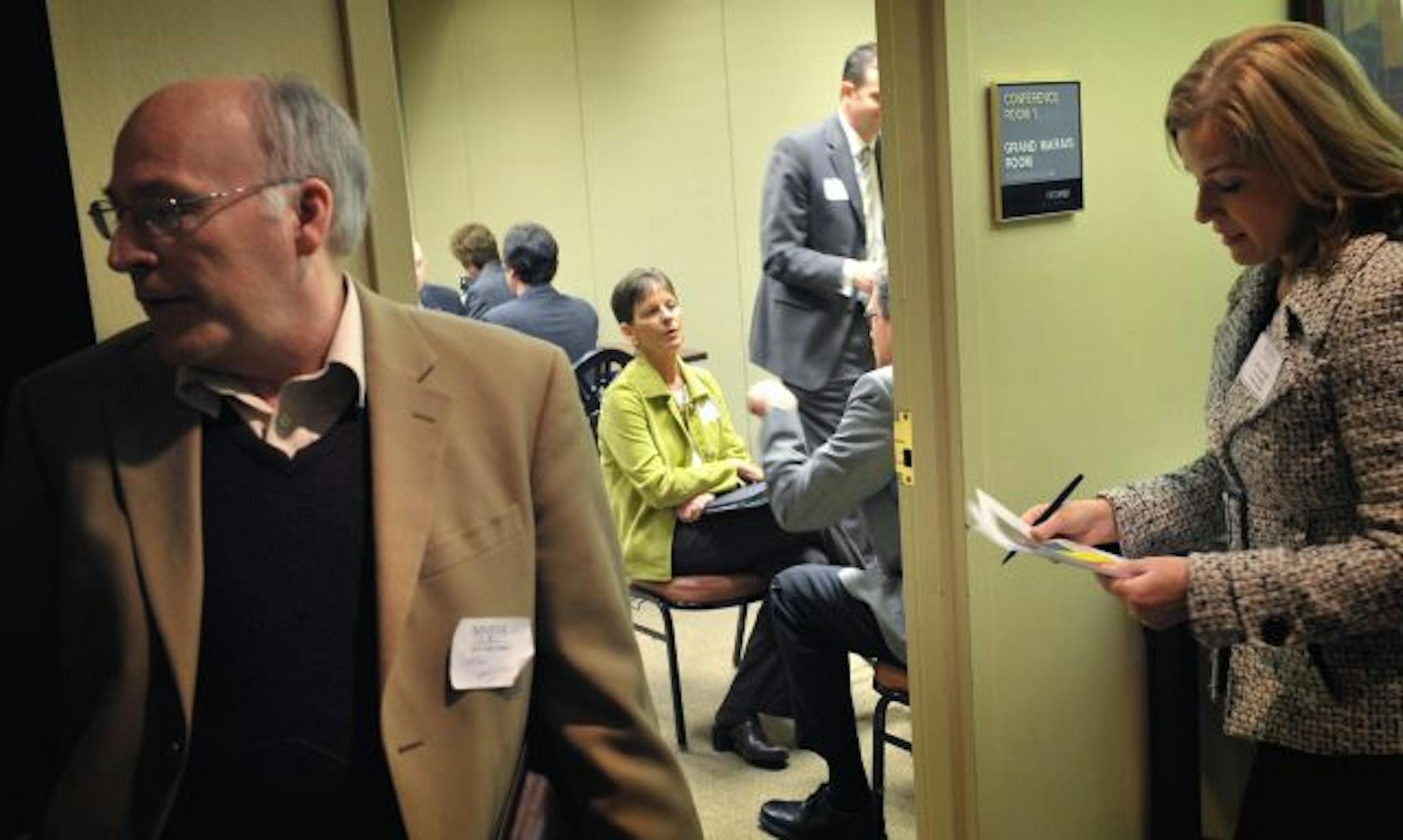 Job seekers such as Mary Korsten, center rear, of Red Wing, and Tom Matthews, left, packed the schedule of people trying to land mock interviews or help punching up résumés. Deb Damhof, right, tried to find ways to get more people into the sessions. People started showing up a half hour before the event began. Minnesota's unemployment rate has stayed at 7.3 percent the past two months.