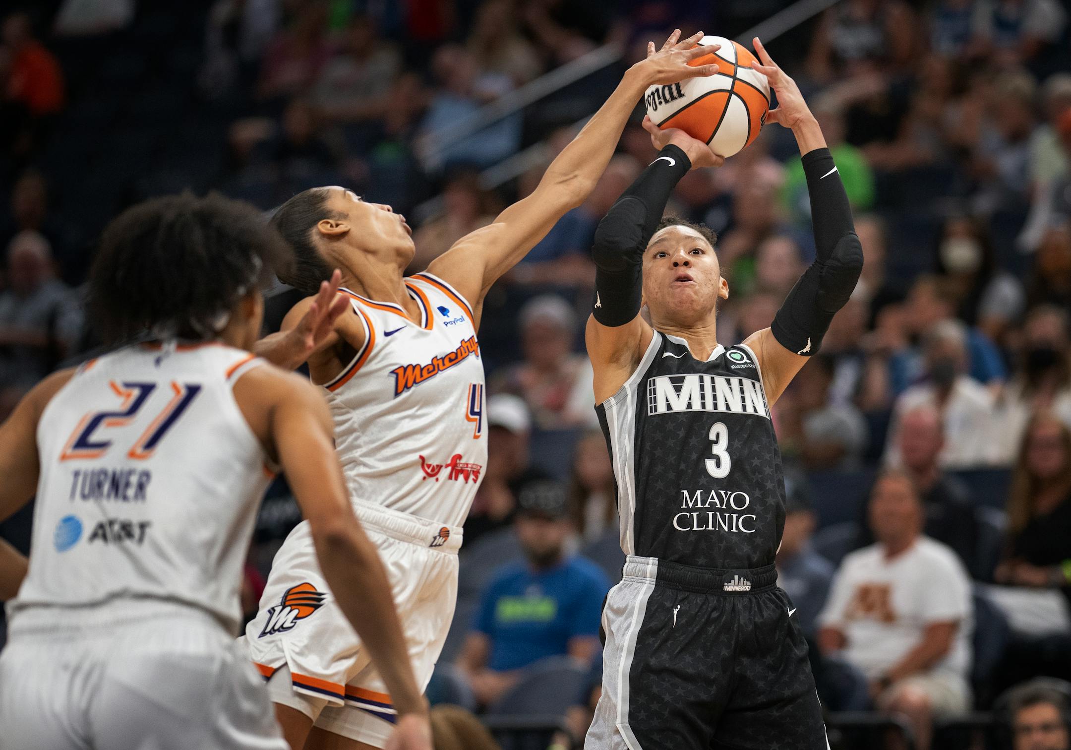 Phoenix Mercury guard Skylar Diggins-Smith, left, fouls Minnesota Lynx forward Aerial Powers (3) as she blocks her shot in the first half.
