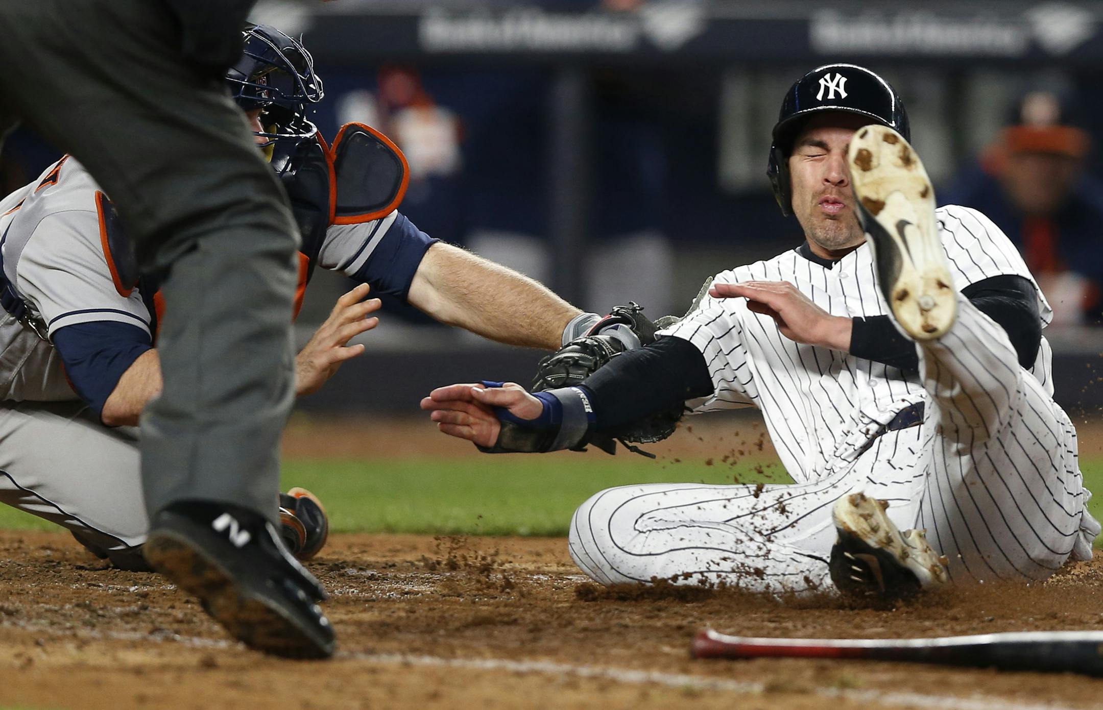Houston Astros catcher Brian McCann, left, tags out New York Yankees' Jacoby Ellsbury at the plate on Gary Sanchez's RBI single for the final out of a baseball game in New York, Thursday, May 11, 2017. The Astros defeated the Yankees 3-2. (AP Photo/Kathy Willens)