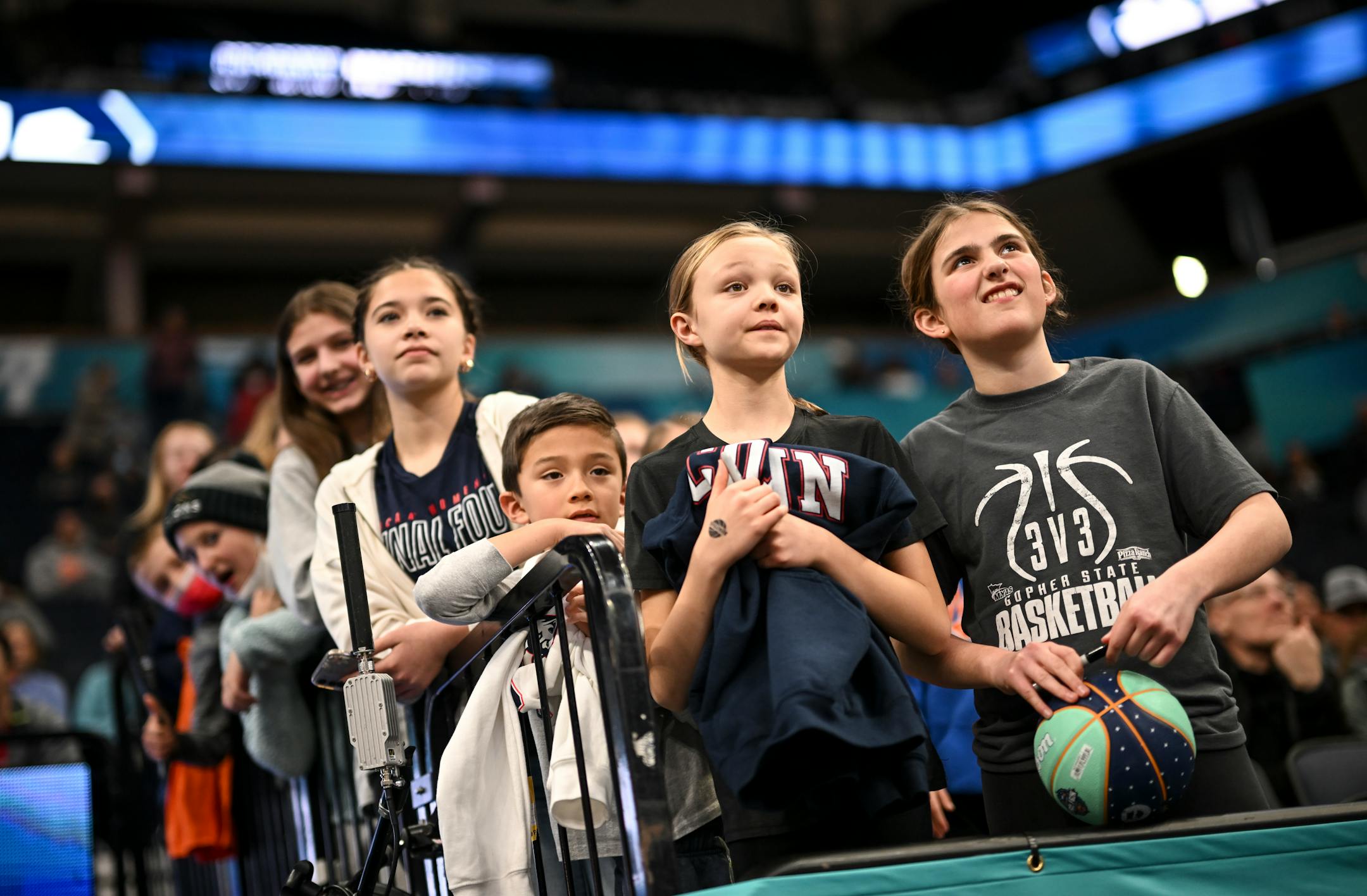 Young fans wait for the chance for a high five or an autograph by players during a Final Four open practice held Saturday, April 2, 2022 at Target Center in Minneapolis, Minn.