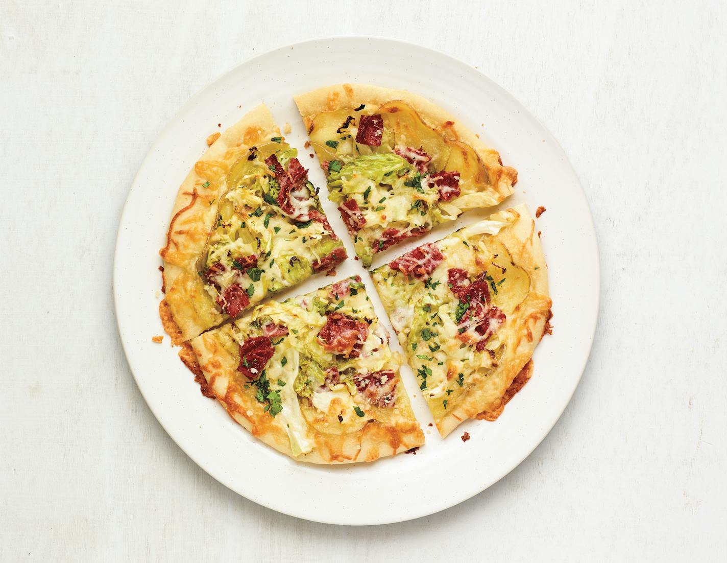 From The Big Book of Pizza by Maile Carpenter and the editors of Food Network Magazine (Hearst Home, $25.00) Corned Beef and Cabbage Pizza