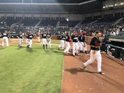 Members of the Chattanooga Lookouts celebrate their 21-inning victory Sunday. Photo courtesy of the Chattanooga Lookouts.