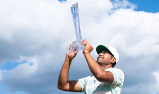 Tony Finau held his trophy after winning the 3M Open last year at the TPC in Blaine.