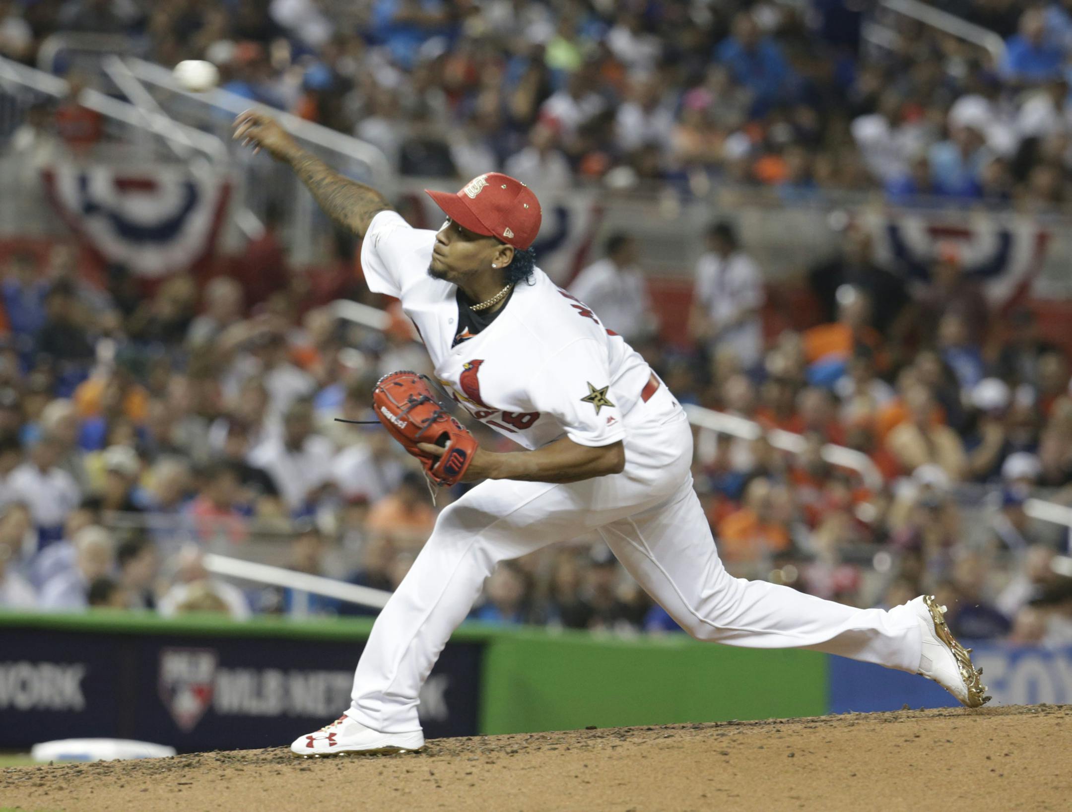 National League's St. Louis Cardinals pitcher Carlos Martlnez (18), delivers a pitch, during the third inning at the MLB baseball All-Star Game, Tuesday, July 11, 2017, in Miami. (AP Photo/Lynne Sladky)