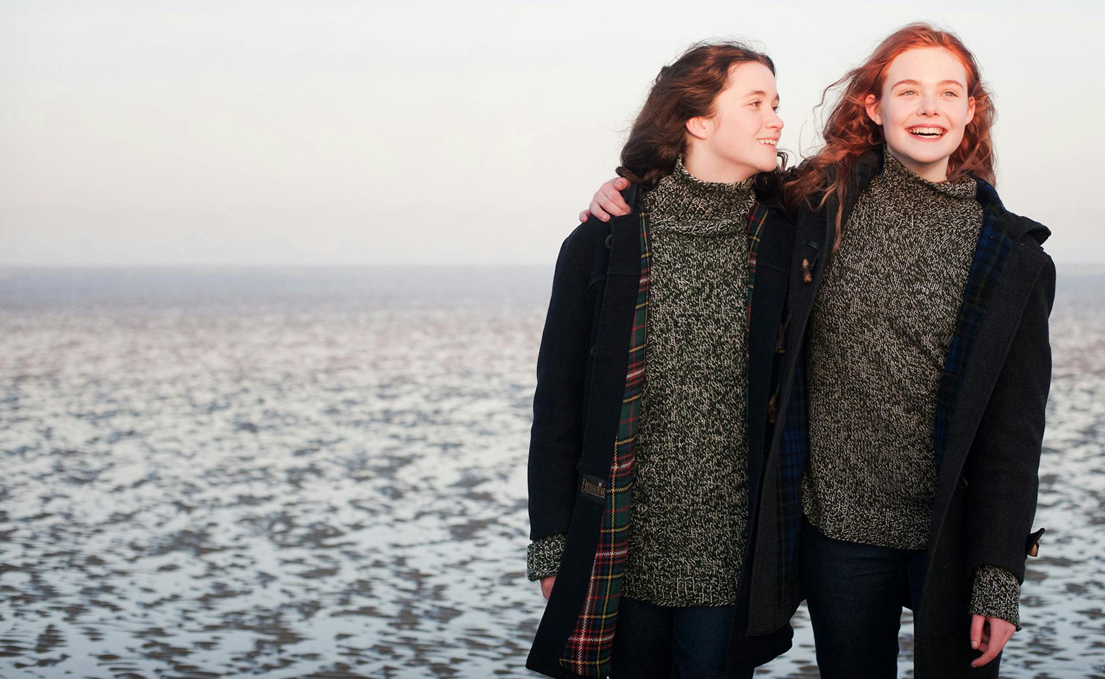 Nicola Dove/A24 Films Alice Englert, left, as Rosa and Elle Fanning as Ginger in "Ginger and Rosa." ORG XMIT: MIN2013032619322581