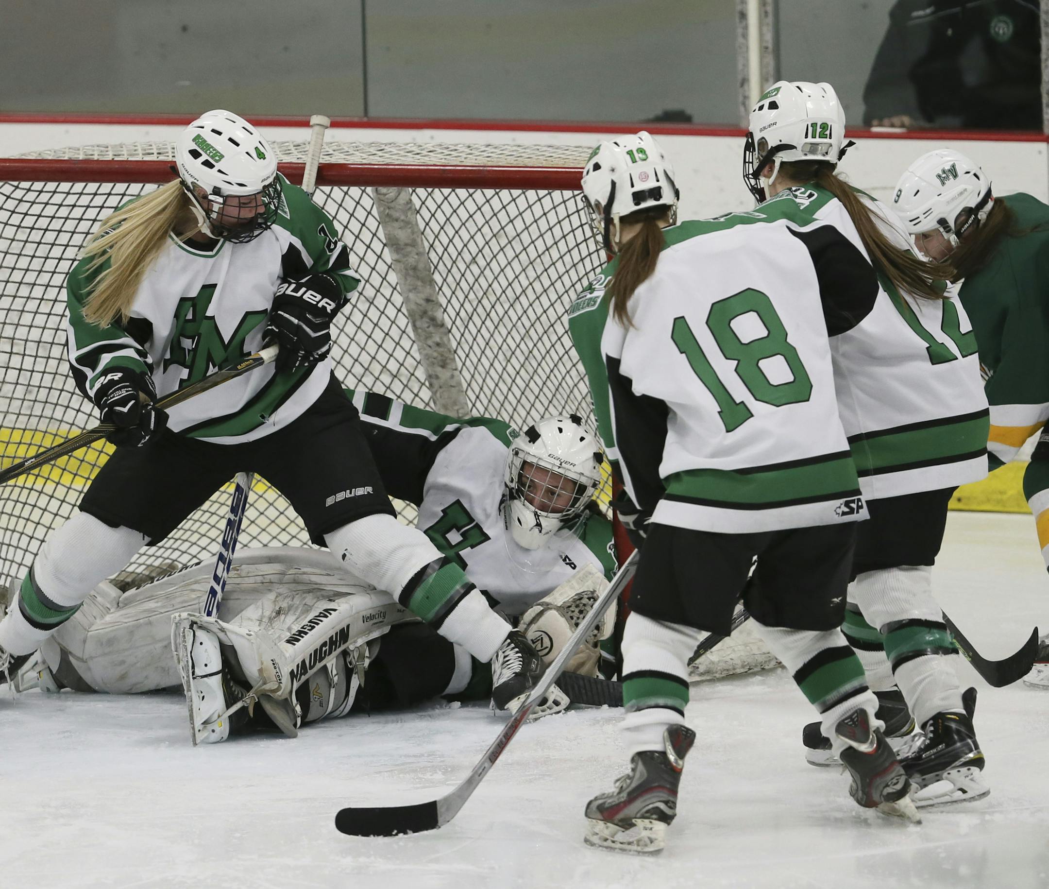 Hill-Murray goalie Ava Bailey (1) blocked a shot on goal with her body during the second period of the Class 2A, Section 4 game between the Pioneers and Mounds View on Thursday at Roseville Ice Arena.