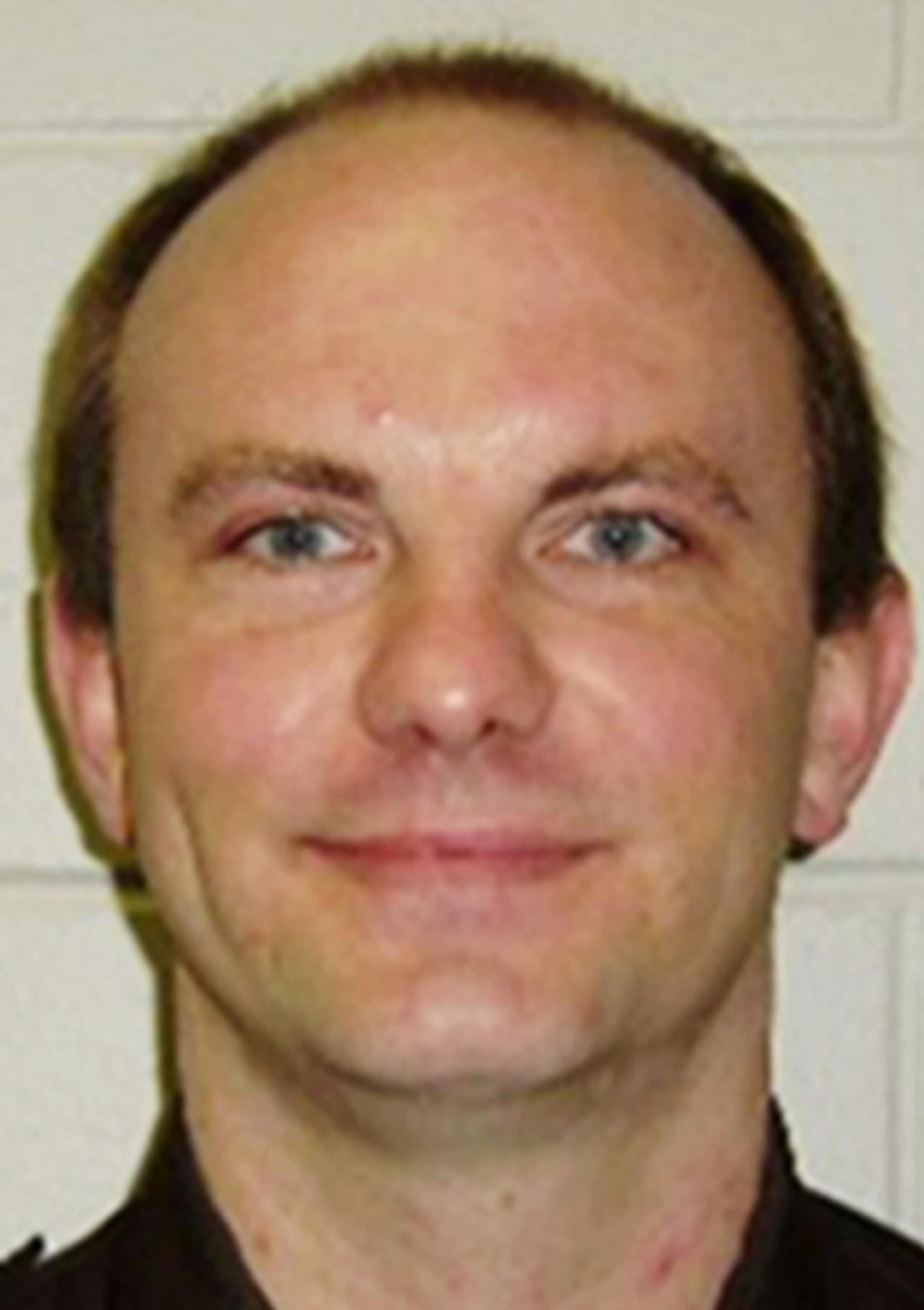 This undated photo provided by the Rusk County Sheriff's Office in Ladysmith, Wis., shows Deputy Dan Glaze, who was killed Saturday night, Oct. 29, 2016, as he investigated a report of a suspicious vehicle in a field several miles from the suspect's residence near Ladysmith. Court records show the man arrested Sunday in the fatal shooting has an extensive criminal record. (Rusk County Sheriff's Office via AP)