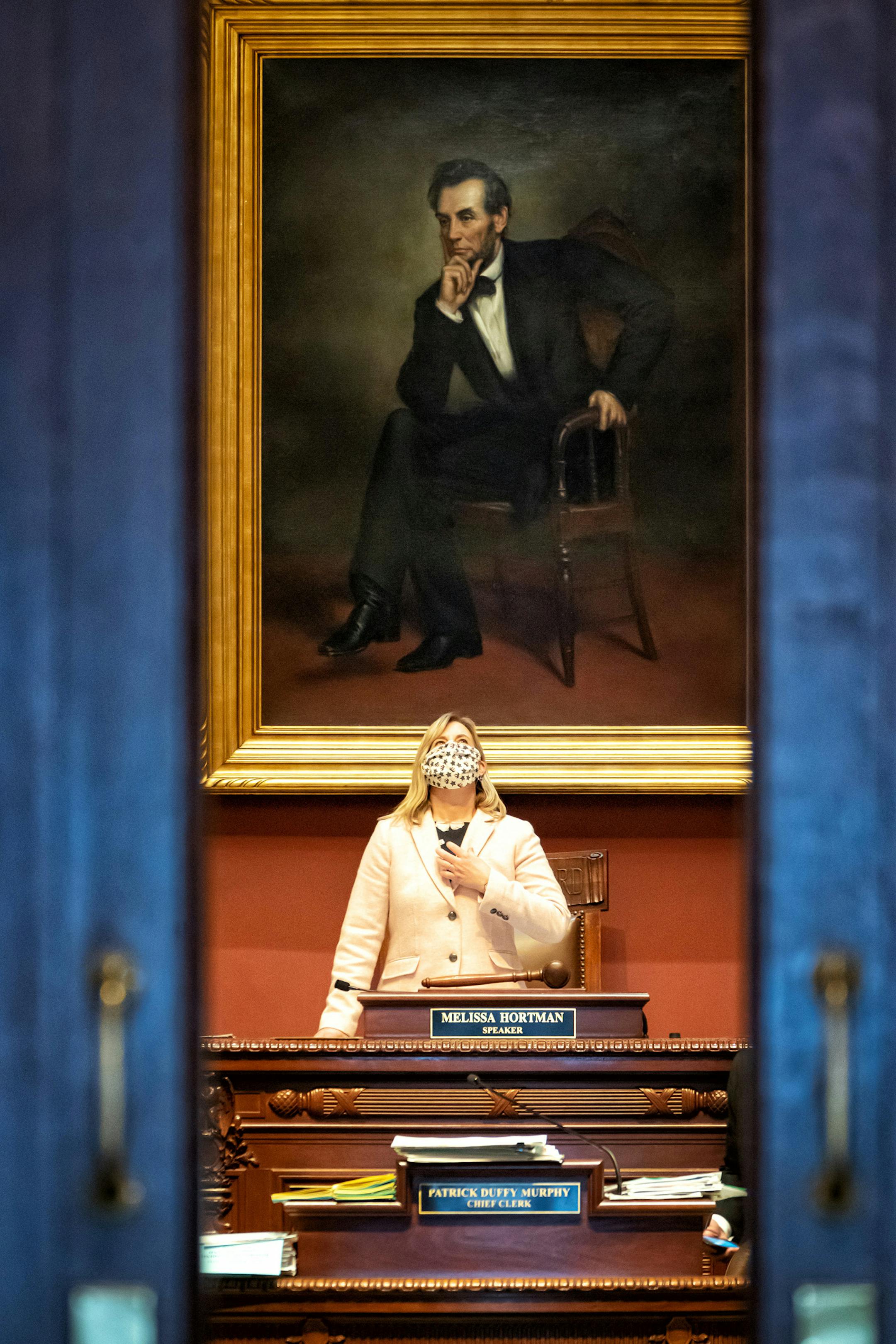 House Speaker Melissa Hortman, DFL-Brooklyn Park, presides over the House Chamber, which is mostly empty due to the pandemic. Most legislators listen to the proceedings by audio and vote remotely by roll call which is taken by Chief Clerk Patrick Duffy Murphy. This is the first day of the final week of the 2020 legislative session.