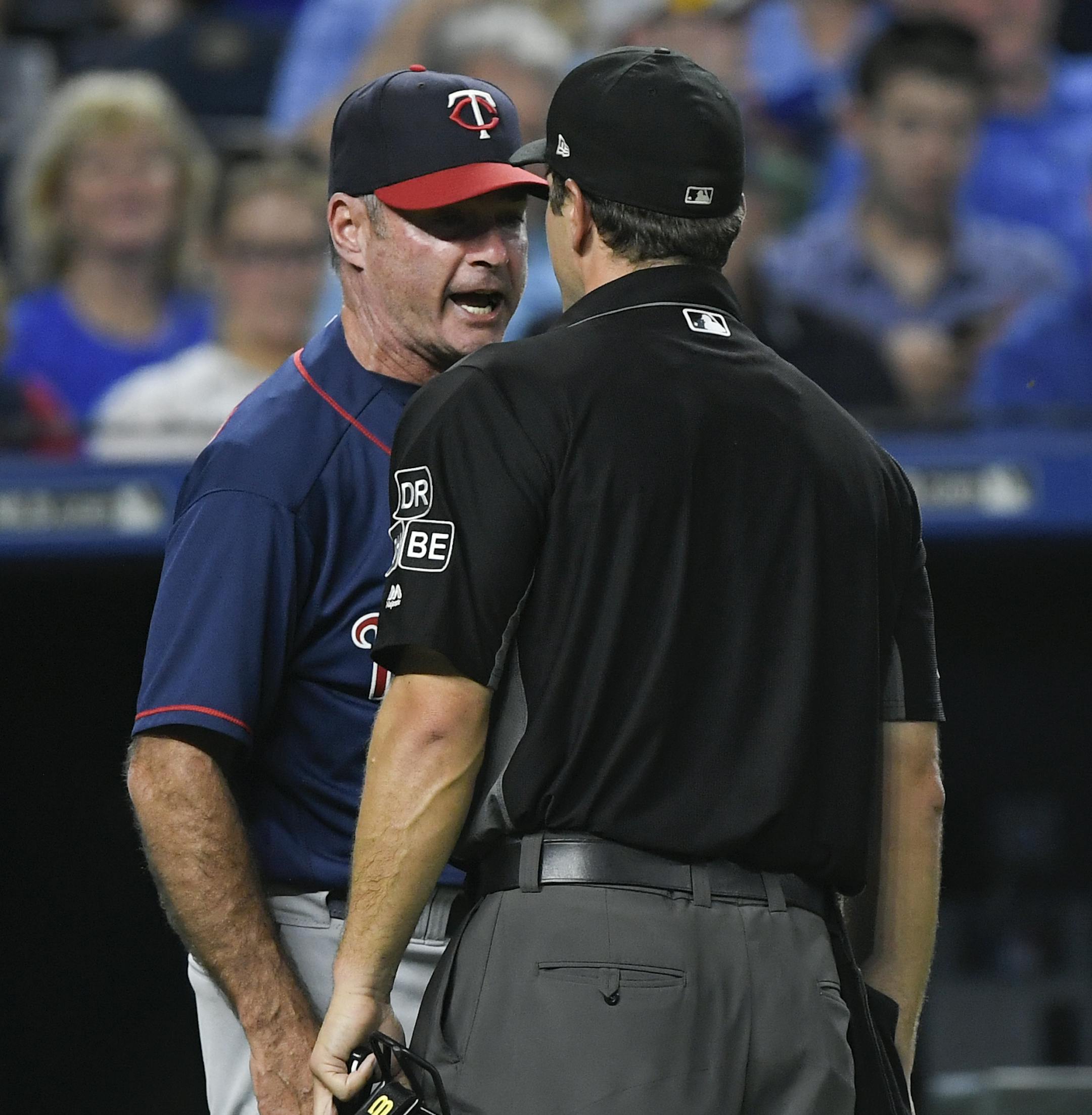 Minnesota Twins manager Paul Molitor, left, argues a call with umpire Ben May and is then ejected during the fourth inning of a baseball game against the Kansas City Royals in Kansas City, Mo., Saturday, Sept. 15, 2018. (AP Photo/Reed Hoffmann)