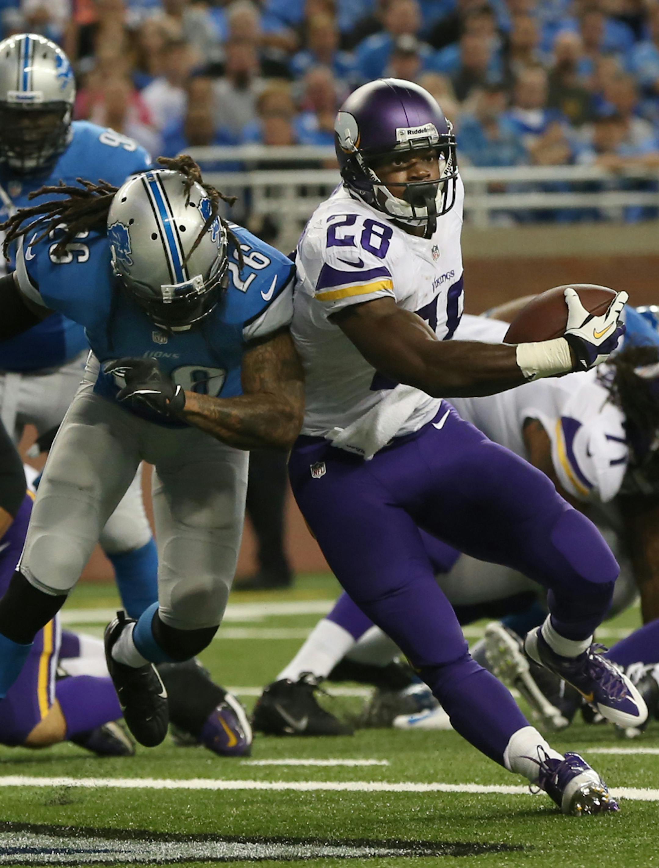 Vikings running back Adrian Peterson ran up the middle for a 4-yard touchdown after making contact with safety Louis Delmas at the goal line in the second quarter. ] Minnesota Vikings and Detroit Lions - Ford Field MCKENNA EWEN · mckenna.ewen@startribune.com Detroit, MI - 09/08/2013