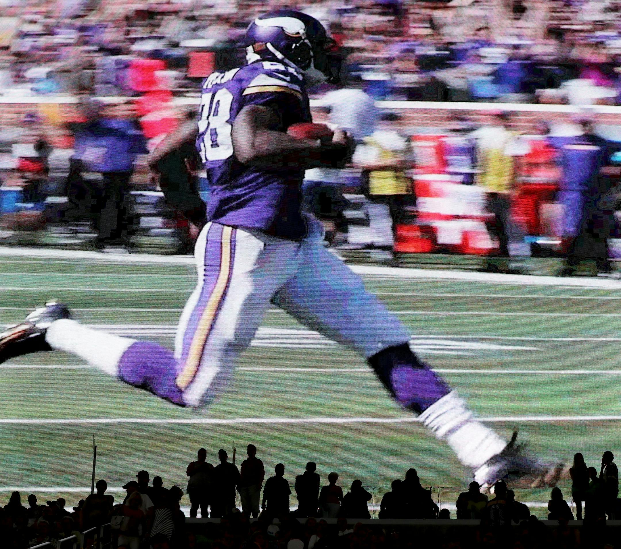 On a giant video monitor, Minnesota Vikings running back Adrian Peterson is seen on a highlight reel at the new U.S. Bank Stadium during an open house for the public Saturday, July 23, 2016, in Minneapolis, MN.