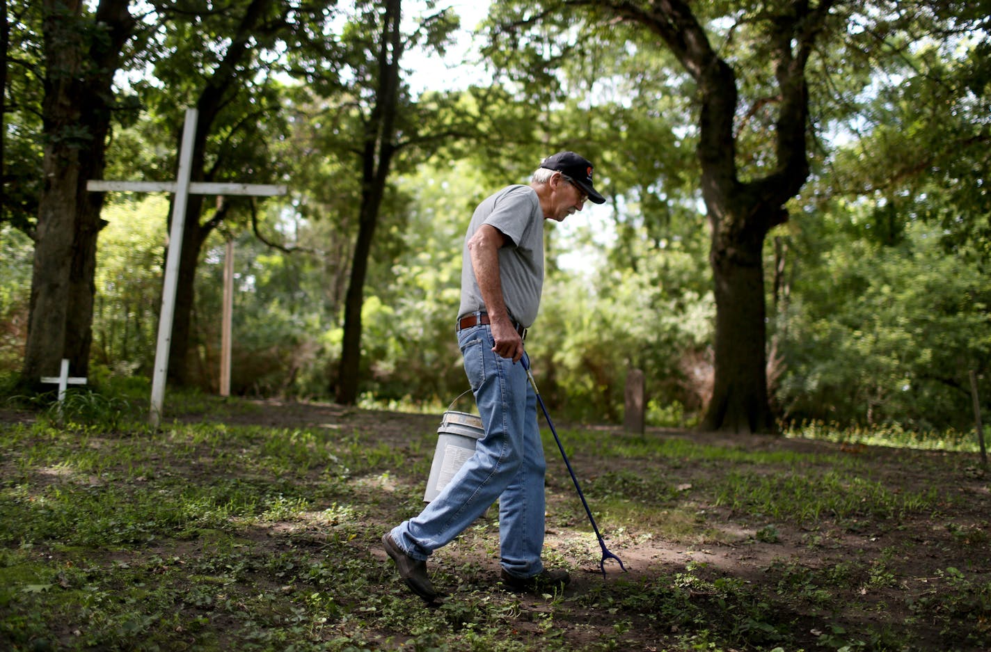 Jim Tafro, 72, has been sprucing up Spring Lake Cemetary, founded in 1861, since early December, despite an upcoming back surgery. Tafro was seen using a grabber to pick up sticks at the cemetery Tuesday, Aug. 23, 2016, in Hastings, MN. Tafro has worked at the cemetery without any pay, seven days a week and has missed just 17 days--two weeks for a vacation in Arizona and three days in the winter when the weather was bitterly cold. He does it because he believes it is the right thing to do to sho