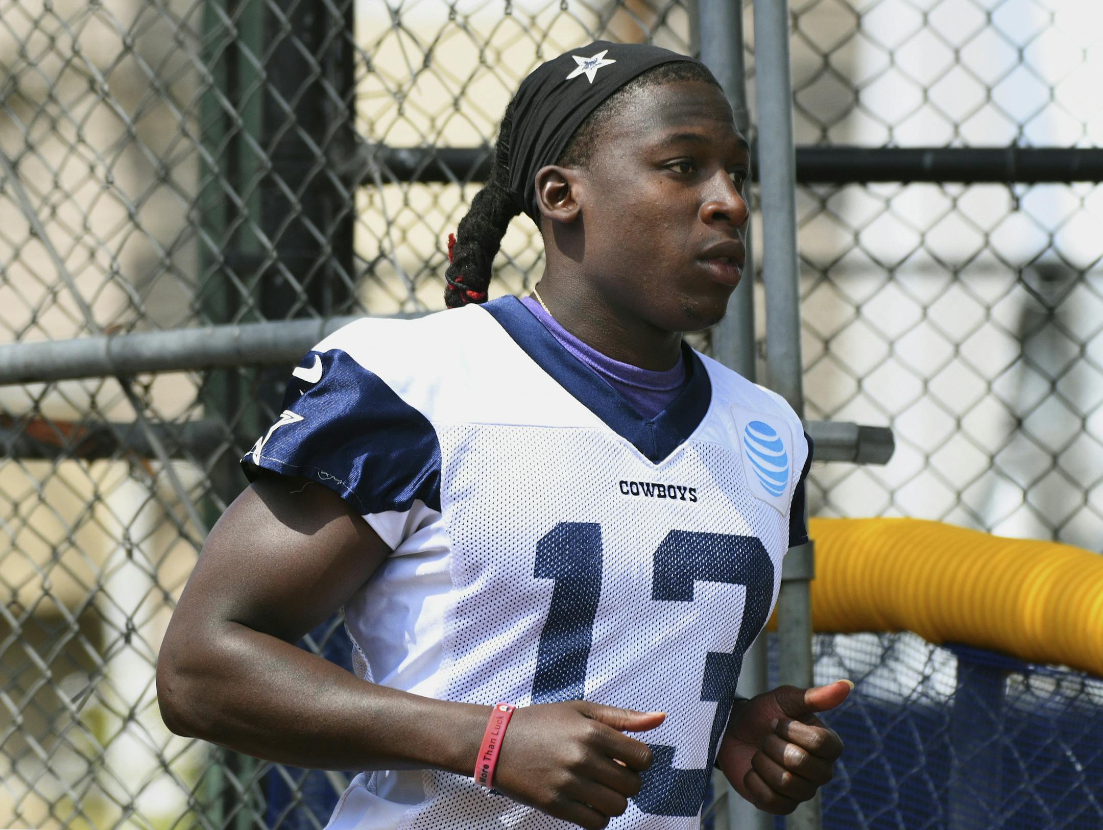 Dallas Cowboys wide receiver Lucky Whitehead (13) runs onto the field for practice at the NFL team's football training camp in Oxnard, Calif., Monday, July 24, 2017. (AP Photo/Michael Owen Baker)