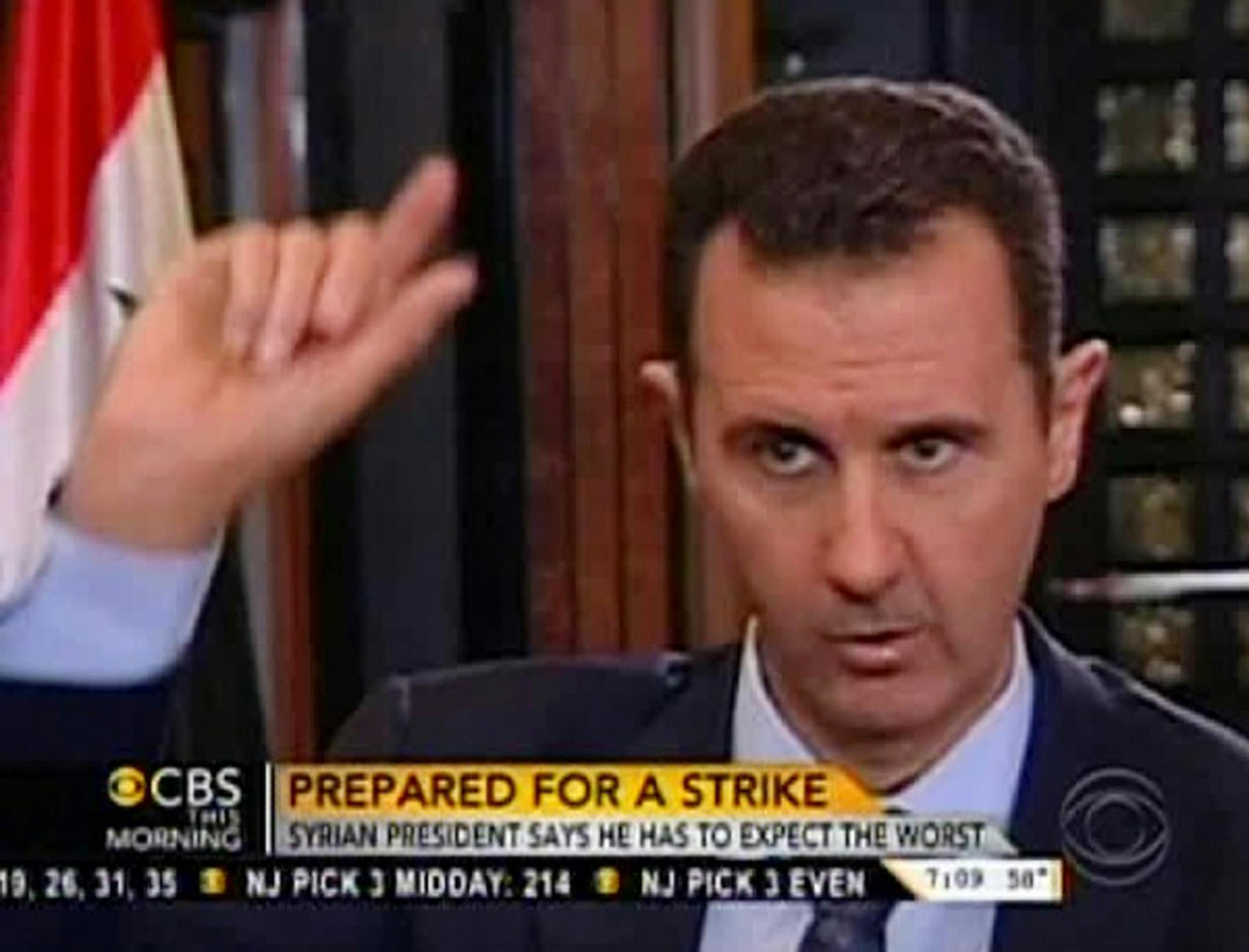 In this frame grab from video taken Sunday, Sept. 8, 2013, and provided by "CBS This Morning," Syrian President Bashar Assad responds to a question from journalist Charlie Rose during an interview in Damascus, Syria. Assad warned in the interview broadcast Monday on CBS there will be retaliation against the U.S. for any military strike launched in response to the alleged chemical weapons attack. Assad said, "You should expect everything."