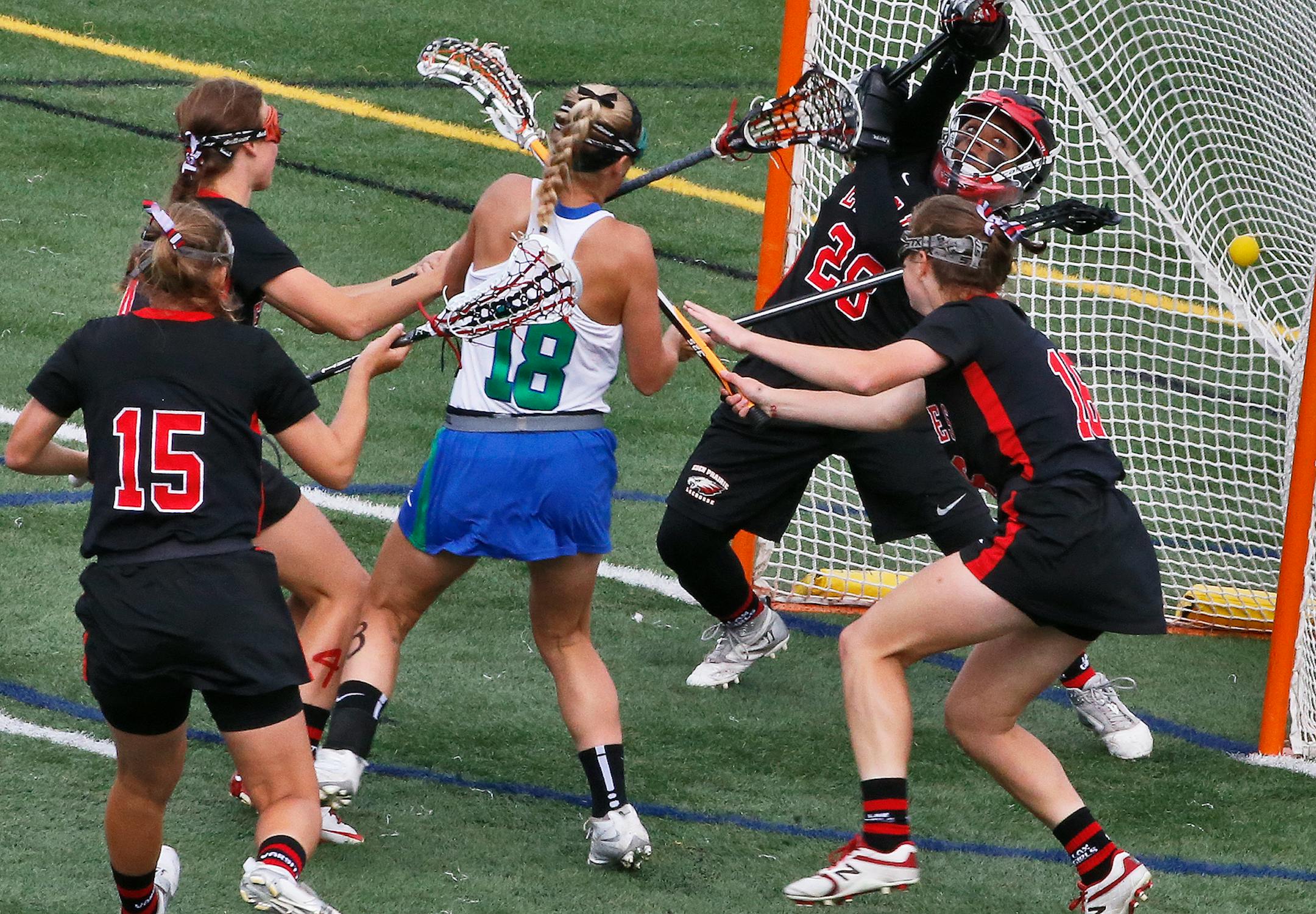Blake's Lydia Sutton (18) threaded her way through Eden Prairie defenders to score a first-half goal in last year's girls' lacrosse state championship game. The team meet again Friday.