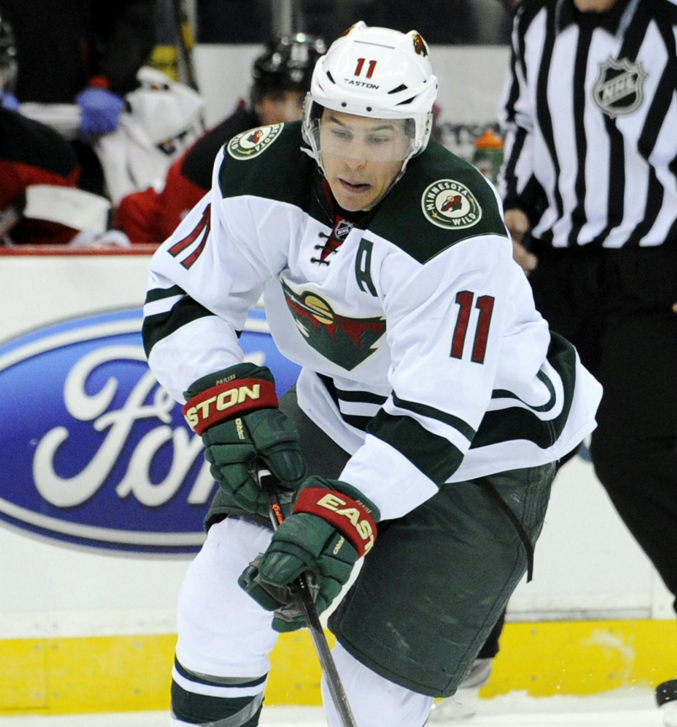 Minnesota Wild's Zach Parise skates in on a breakaway during the first period of an NHL hockey game against the New Jersey Devils, Thursday, March 20, 2014, in Newark, N.J. (AP Photo/Bill Kostroun)