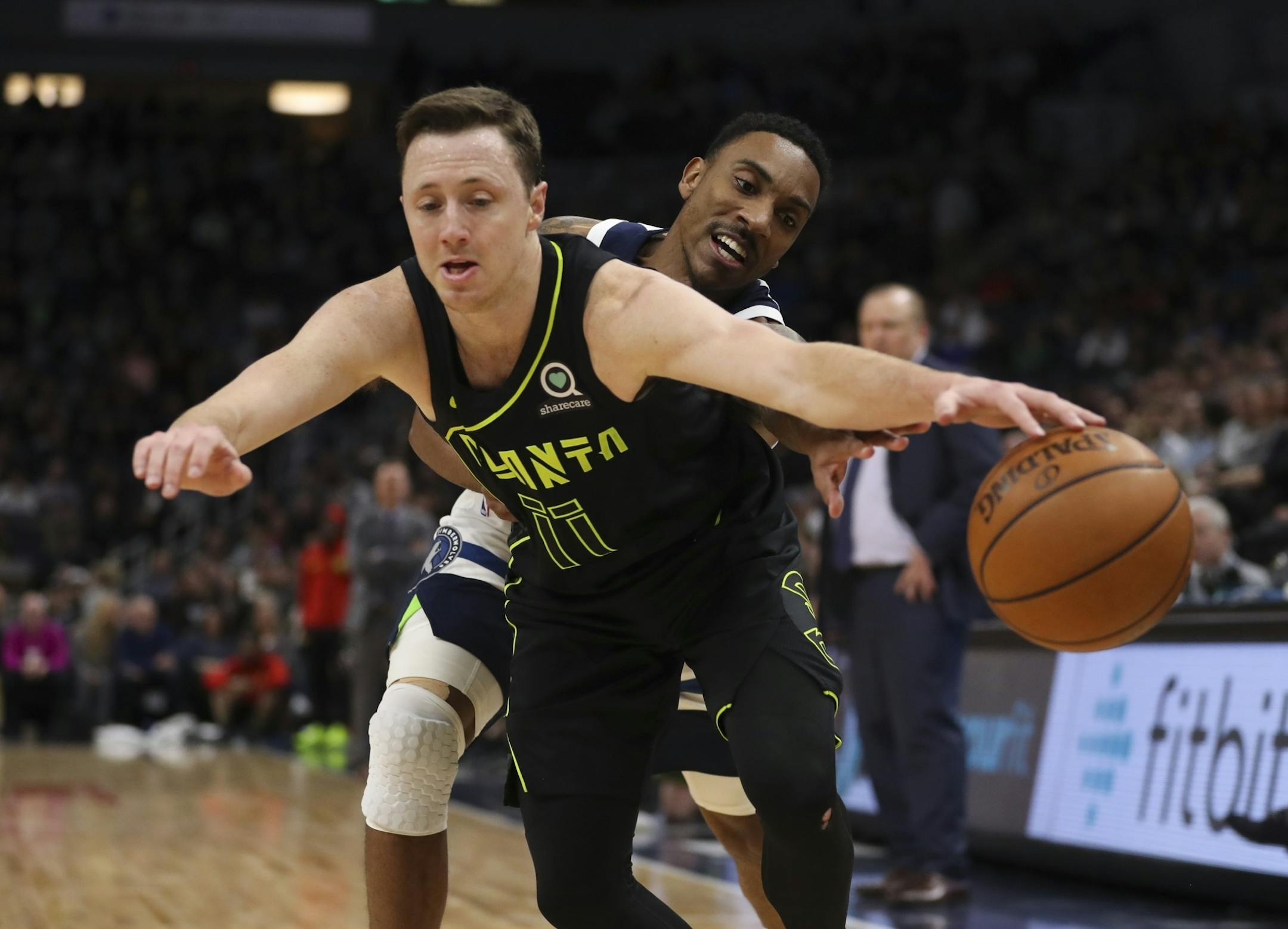 Minnesota Timberwolves guard Jeff Teague (0) disrupted the advance of Atlanta Hawks guard Josh Magette (11) in the second quarter.