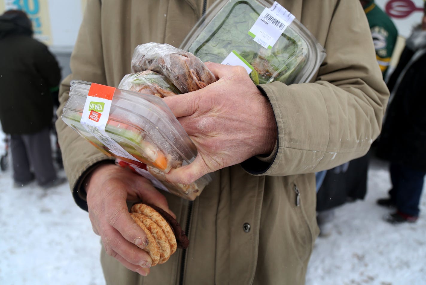 The local non-profit, Loaves and Fishes has partnered with the MSP Airport and concessionaire HMS Host to donate ready-to-eat meals not purchased at the airport, that would otherwise be thrown away, to the homeless near the Dorothy Day Center Thursday, Dec. 28, in St. Paul, MN.] DAVID JOLES &#xef; david.joles@startribune.com The local non-profit, Loaves and Fishes, has partnered with the MSP Airport and concessionaire HMS Host to donate ready-to-eat meals not purchased at the airport to the home