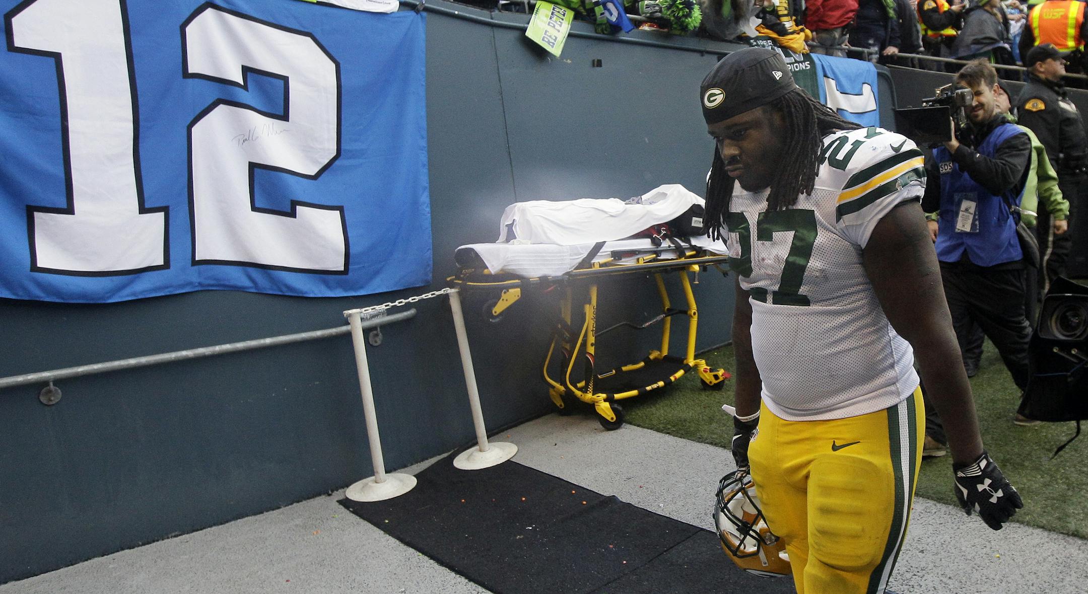 Green Bay Packers' Eddie Lacy looks down as he walks off the field after overtime of the NFL football NFC Championship game against the Seattle Seahawks Sunday, Jan. 18, 2015, in Seattle. The Seahawks won 28-22 to advance to Super Bowl XLIX. (AP Photo/Jeff Chiu)