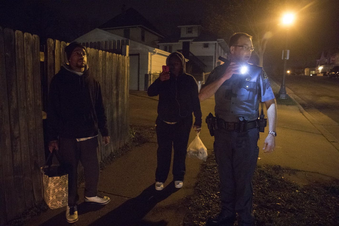 Friends and relatives held a candlelight vigil at the intersection of St. Albans and Fuller in St. Paul on Monday night, April 17, 2017 for a man who was fatally shot that afternoon. The vigil was interrupted by gunfire, but no one was reported injured. Photo by Chris Juhn/special to the Star Tribune