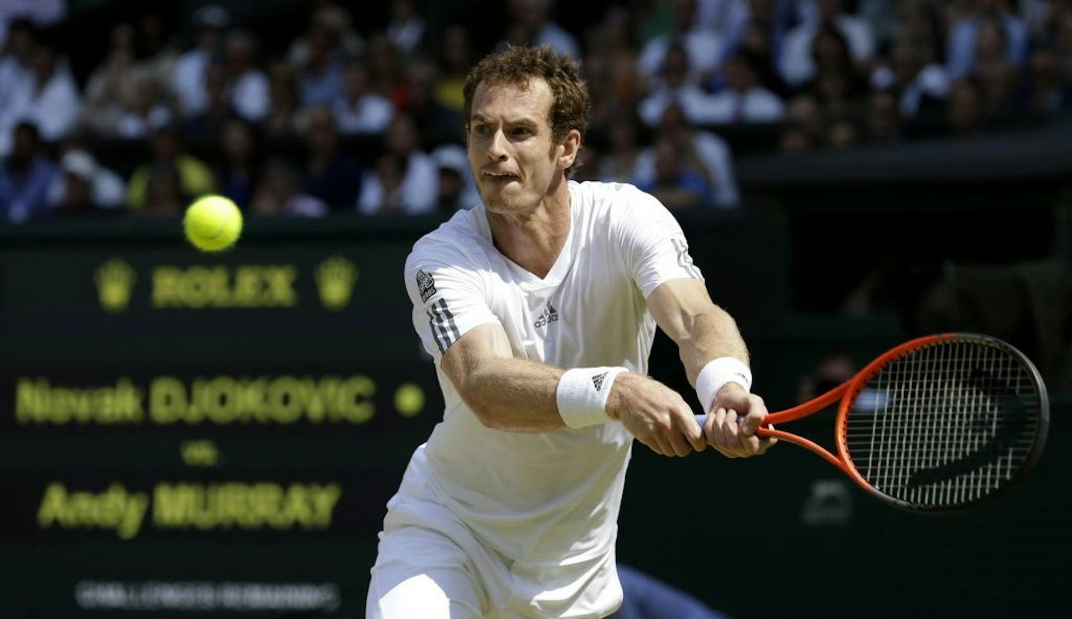 Andy Murray of Britain returns to Novak Djokovic of Serbia during the Men's singles final match at the All England Lawn Tennis Championships in Wimbledon, London, Sunday, July 7, 2013.