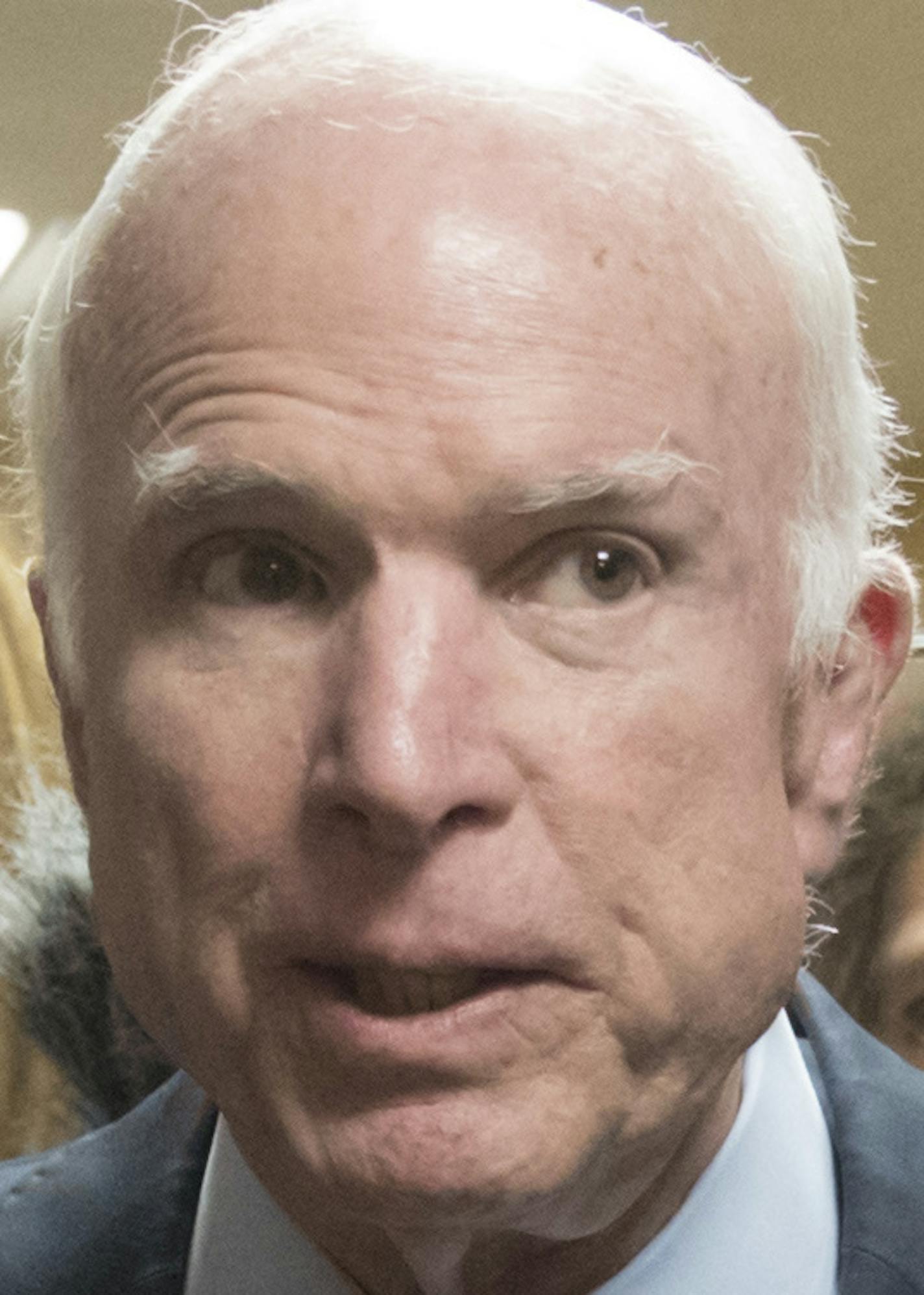 Sen. John McCain, R-Ariz., is surrounded by reporters as he and other lawmakers arrive for a vote, at the Capitol in Washington, Tuesday, Oct. 17, 2017. (AP Photo/J. Scott Applewhite)