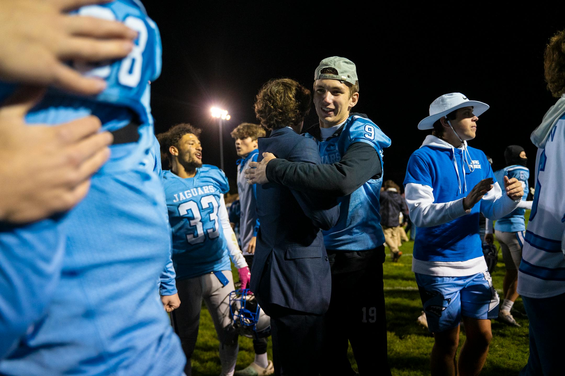 Bloomington Jefferson teammates celebrate their 34-20 win against Robbinsdale Cooper.