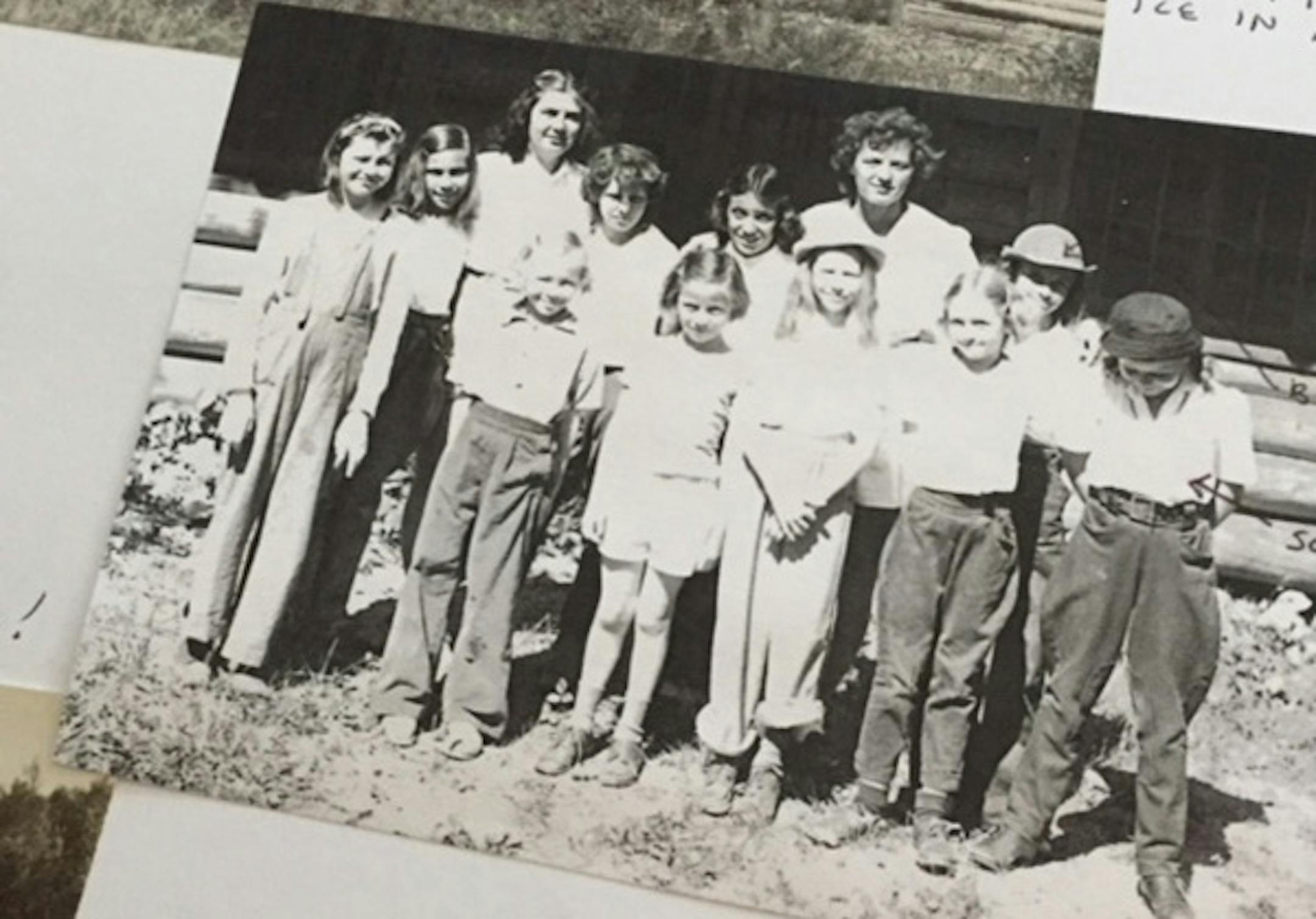 Camp Kiwadinipi in 1944 near Ely, Minn. The author is at far right, looking down. She first went to camp with a neighbor friend from across the street. Mary, or Butch, her required camp nickname, is over her right shoulder in the second row, wearing a hat.
