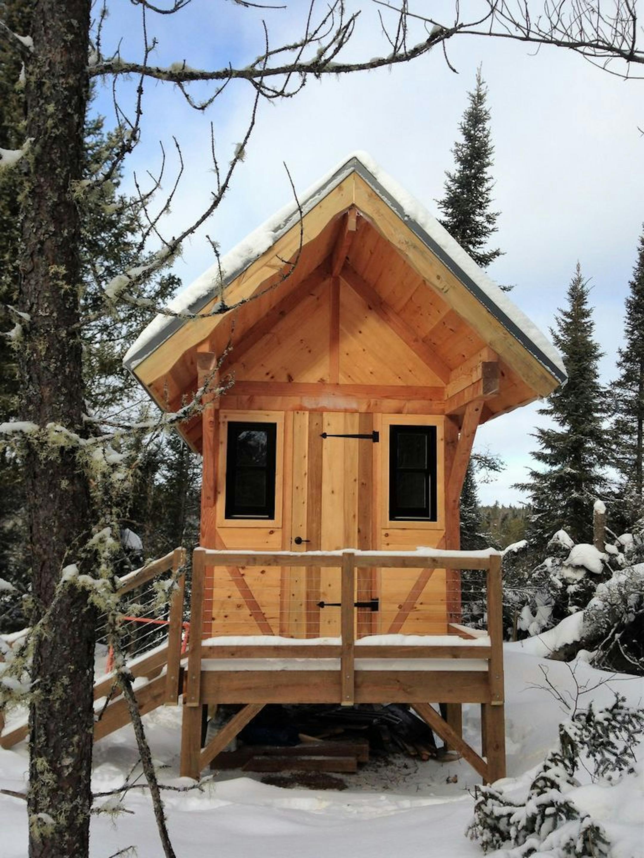 The wood-fired "wee sauna" on the property matches the cabin.