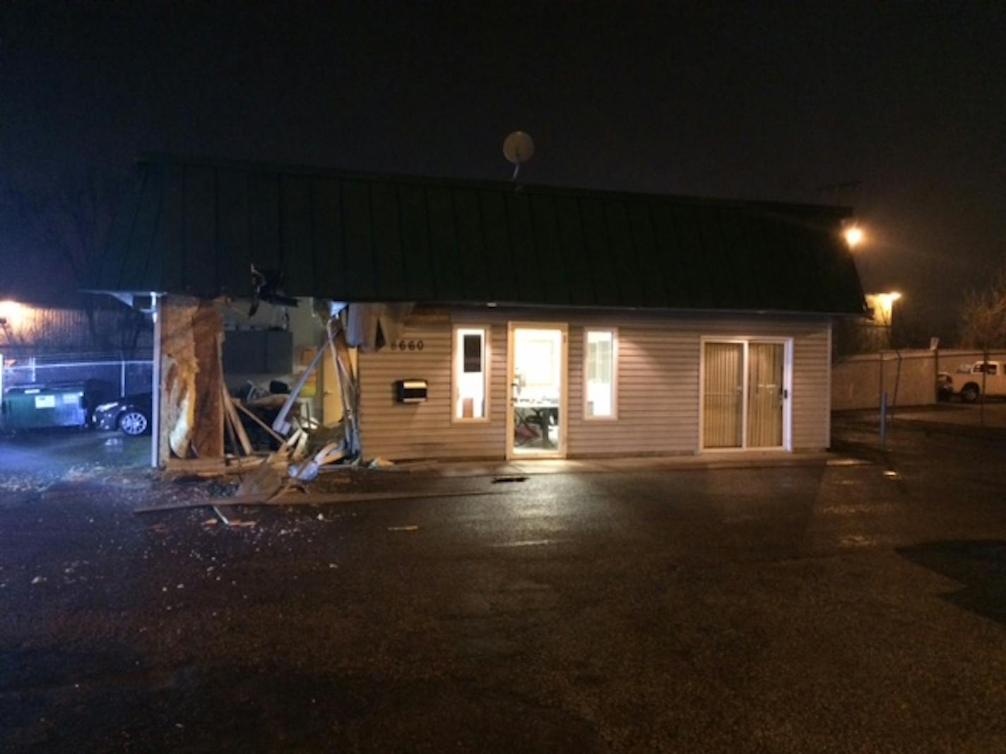 This Hopkins used-car dealership was damaged by a 15-year-old boy who allegedly stole a front-end loader in St. Paul and drove it at least 22 miles across town.