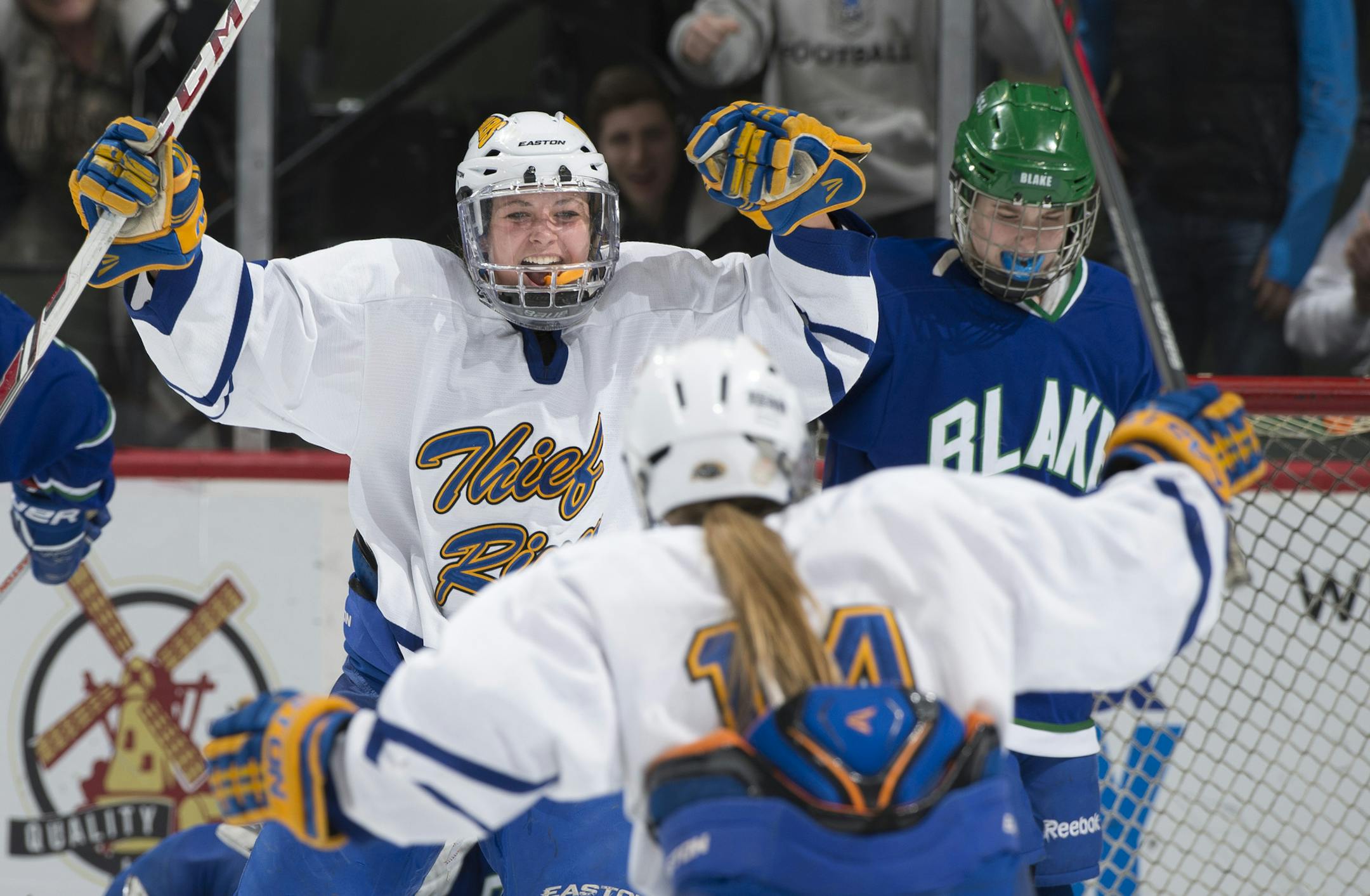 Thief River Falls forward Kora Torkelson (22), left, celebrates with defender Briana Jorde (14) after Torkelson scored a goal against Blake in the second period to tie the game. ] (Aaron Lavinsky | StarTribune) The Blake School plays Thief River Falls in the 1A Girls' Hockey Championship game on Saturday, Feb. 21, 2015 at Xcel Energy Center in St. Paul.