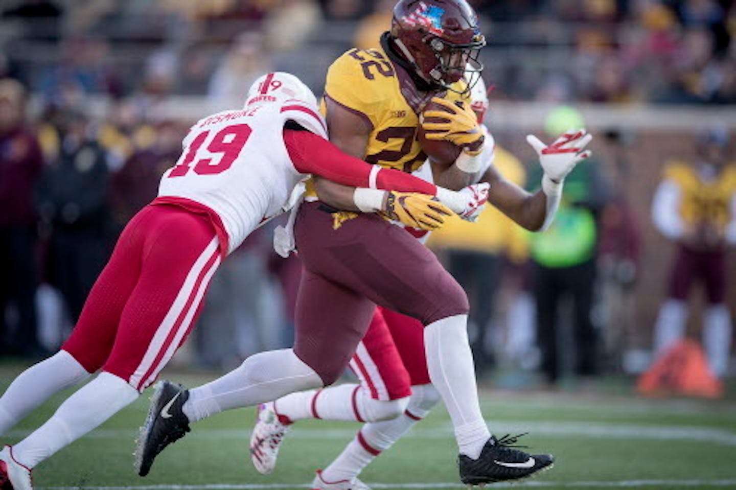 Minnesota's running back Kobe McCrary  plowed through Nebraska's defensive back Marquel Dismuke, left, and Chris Jones, right, into the end zone for a touchdown during the third quarter as the Gophers took on Nebraska, Saturday, November 11, 2017 at TCF Bank Stadium in Minneapolis, MN.   ]  ELIZABETH FLORES ' liz.flores@startribune.com