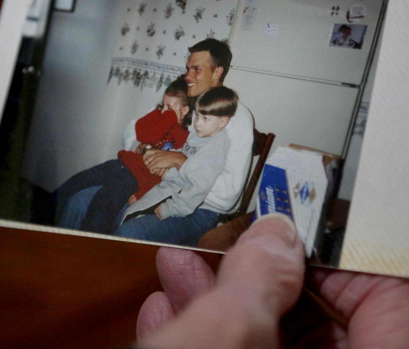 Diane Johnson, Patriot's star quarterback Tom Brady's aunt, holds a photo of Brady during his playing days at the University of Michigan during a family visit to the small Minnesota and seen Thursday, Jan. 25, 2018, near Browerville, MN.] DAVID JOLES &#xef; david.joles@startribune.com Tom Brady spent his summers as a kid at his grandparents house. He still has family there. National media has been descending on the town this week.