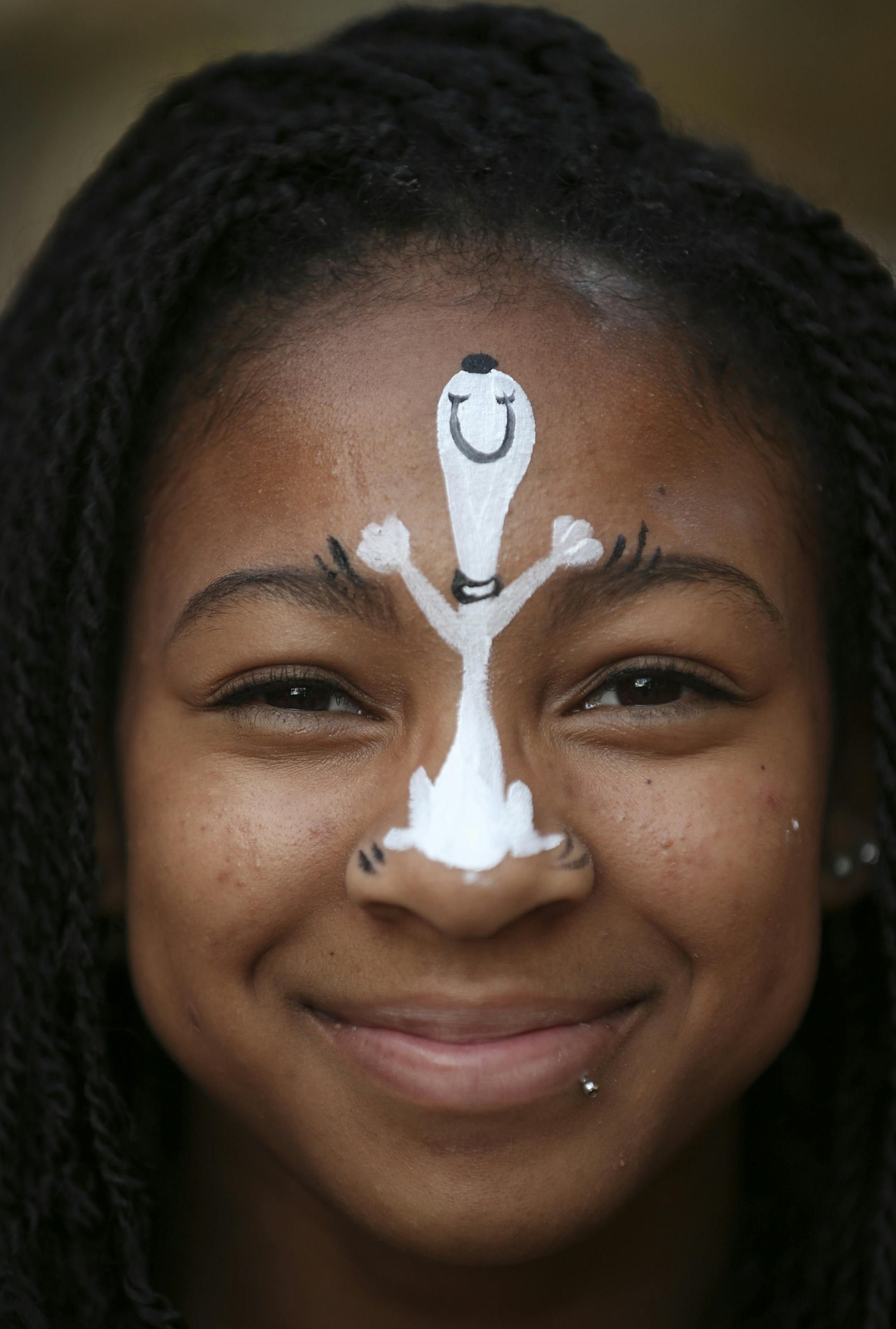 Tazhanae Gant, 15, had a Snoopy painted on her face at the event Tuesday evening in St. Paul. She's a Peanuts fan, she said, from watching all the holiday television specials every year. ] JEFF WHEELER ï jeff.wheeler@startribune.com In an event outside Landmark Center late Tuesday afternoon, St. Paul Mayor Chris Coleman proclaimed Tuesday, October 20, 2015 "Charles M. Schulz Day" in honor of one of the city's best loved native sons, the author of the comic strip "Peanuts." Schulz's son, Cra