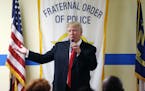 Republican presidential candidate Donald Trump speaks to retired and active law enforcement personnel at a Fraternal Order of Police lodge during a ca