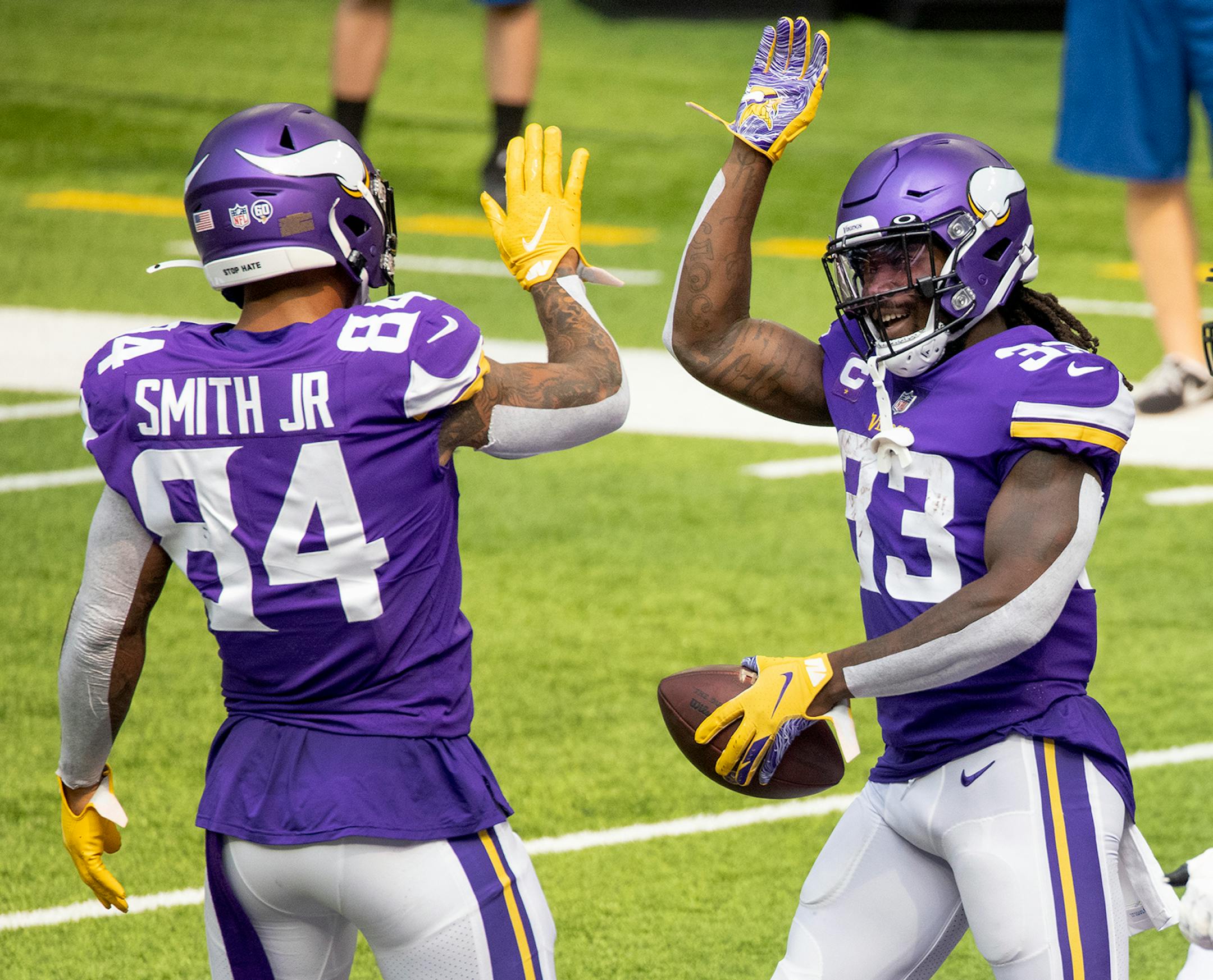 Minnesota Vikings running back Dalvin Cook (33) celebrated with teammates after scoring a touchdown in the first quarter.