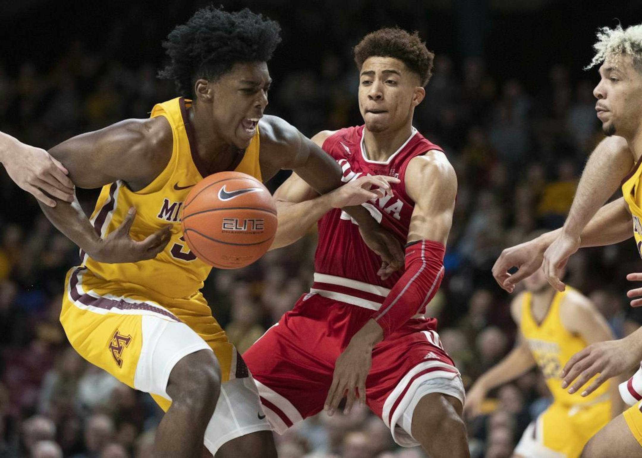 Minnesota Gophers guard Marcus Carr (5) tried to drive to the basket onIndiana Hoosiers guard Rob Phinisee (10) in the first half.