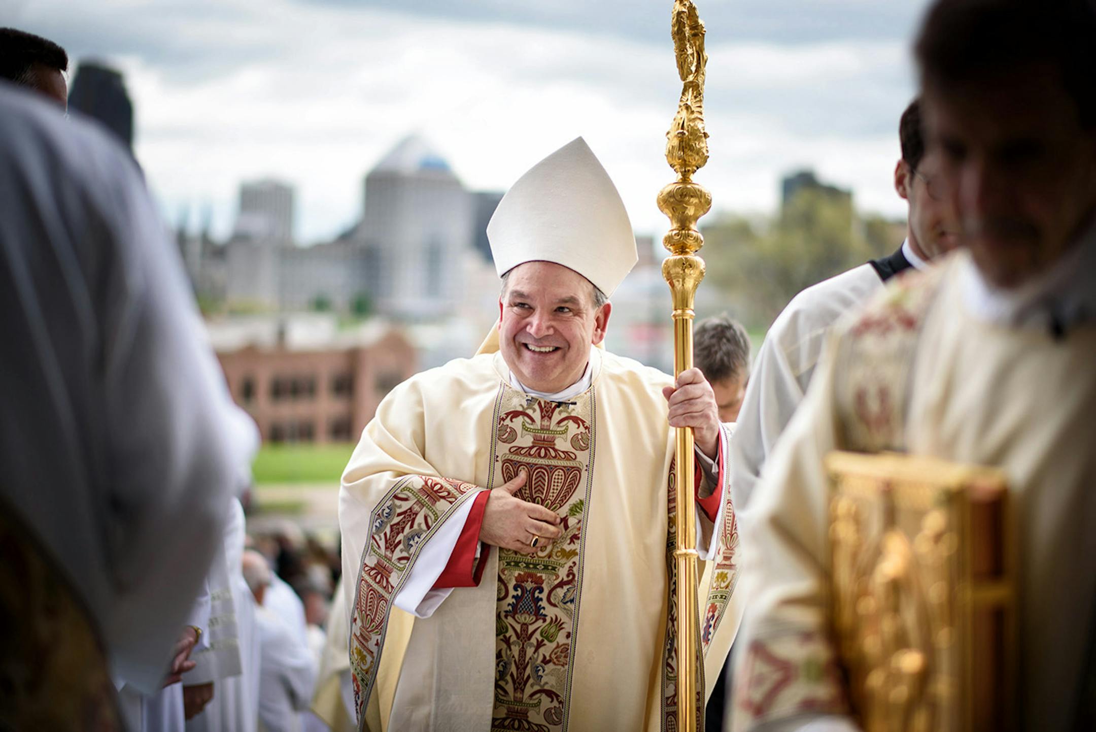 Archbishop Bernard Hebda greeted gathered preists and deacons outside the St. Paul Cathedral