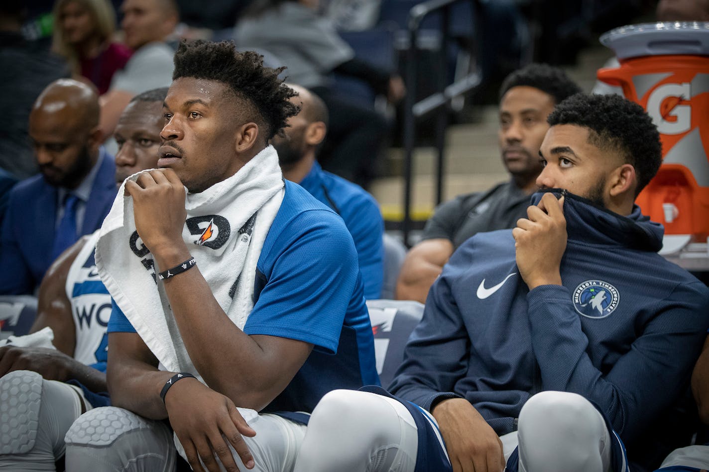 Timberwolves guard Jimmy Butler, left, and center Karl-Anthony Towns watched the game from the bench during the fourth quarter