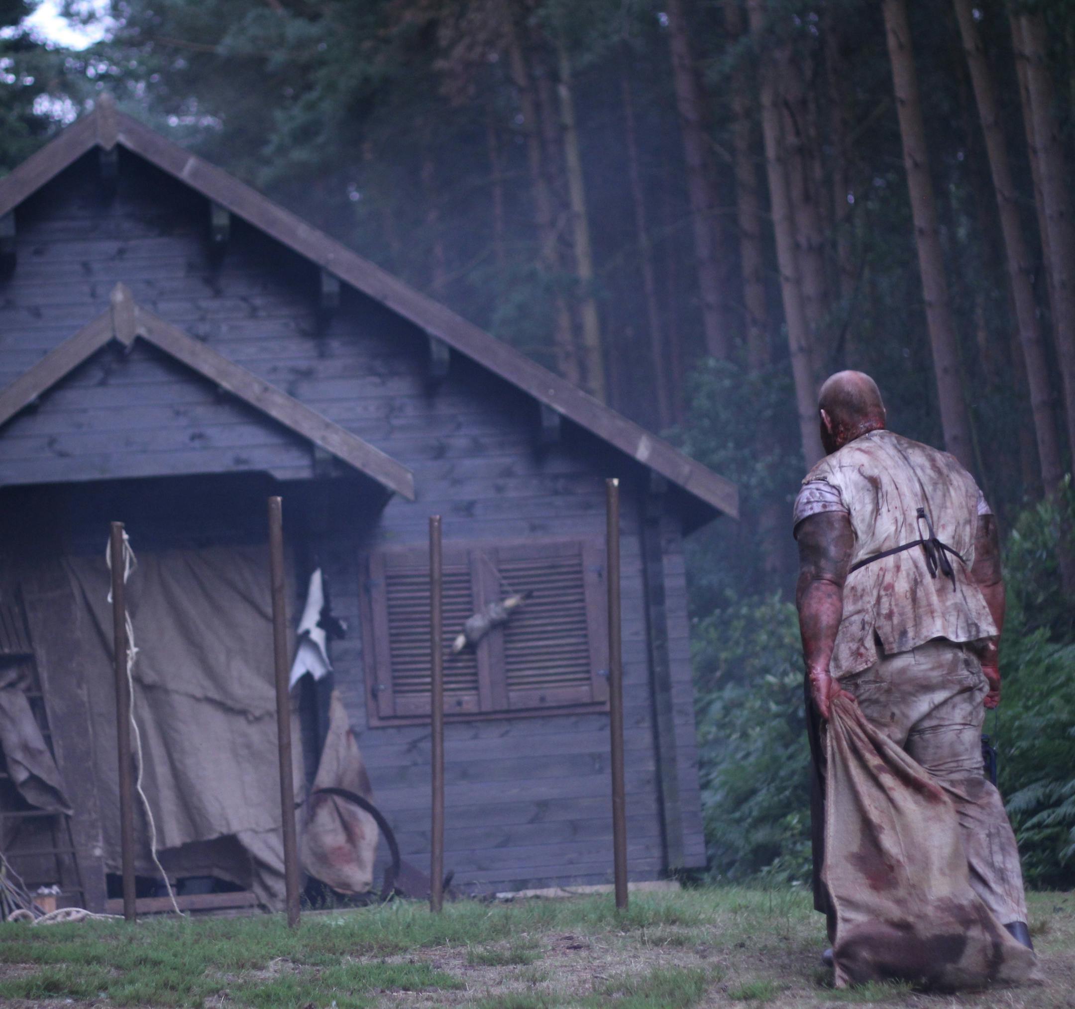 DRAMA Pigman with sack of parts near cabin in woods on "Hometown Horror"
credit: Travel Channel