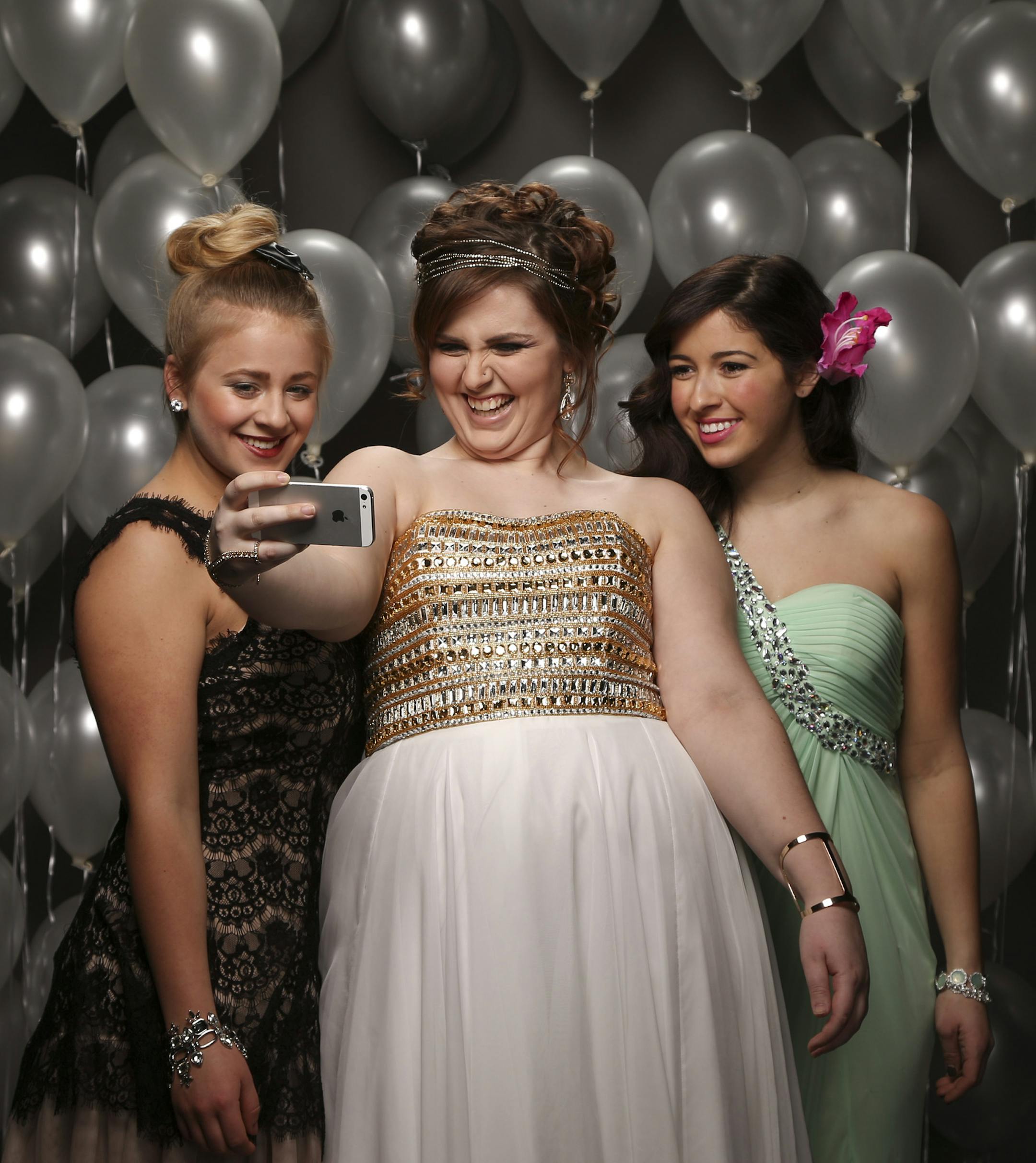 Kali Mann, a senior at St. Paul Conservatory for Performing Artists, Sophie Heyman, a senior at St. Paul Central High School, and Emilee Hassanzadeh, a senior at Bloomington Jefferson High School, from left. ] JEFF WHEELER &#x2022; jeff.wheeler@startribune.com Prom looks that are variations on the theme, "What's old is new again." Photographed at the Mall of America on Tuesday evening, March 4, 2014. ] JEFF WHEELER &#x2022; jeff.wheeler@startribune.com