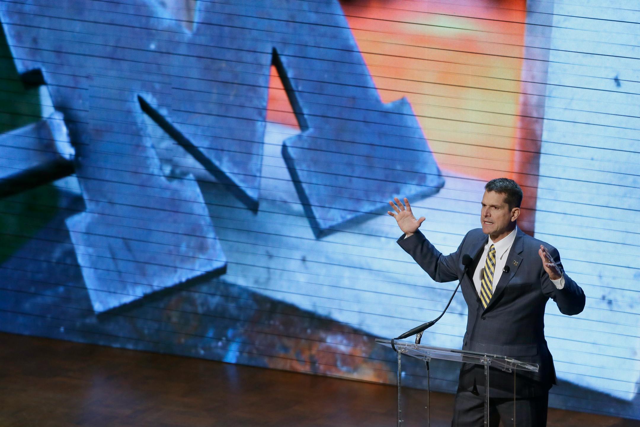 Michigan football coach Jim Harbaugh talke to fans at the Signing With the Stars spectacle on Feb. 3 in Ann Arbor, Mich. College football's recruiting circus has found its ringmaster in Michigan's coach. Harbaugh was the real star of the Wolverines show that former coach Lou Holtz predicted will be copied in years to come by other schools.