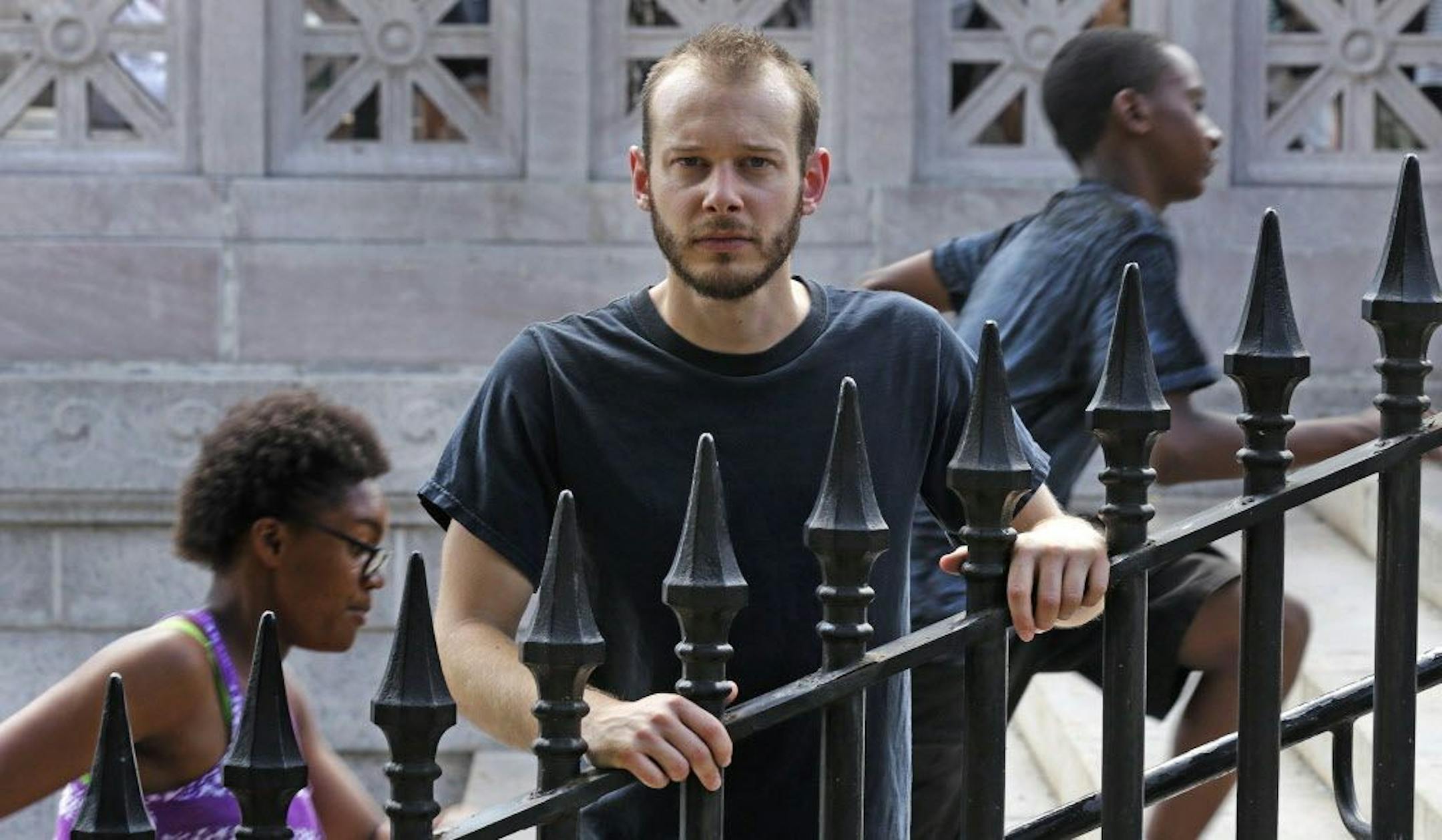 In this Friday, July 22, 2016 photo Collin Allen, the creator of 'White Men for Black Lives', poses on the Boston Common in Boston. Some white Americans say they're being spurred to action by the shootings of black men by officers in Minnesota and Louisiana after long sitting in silence.